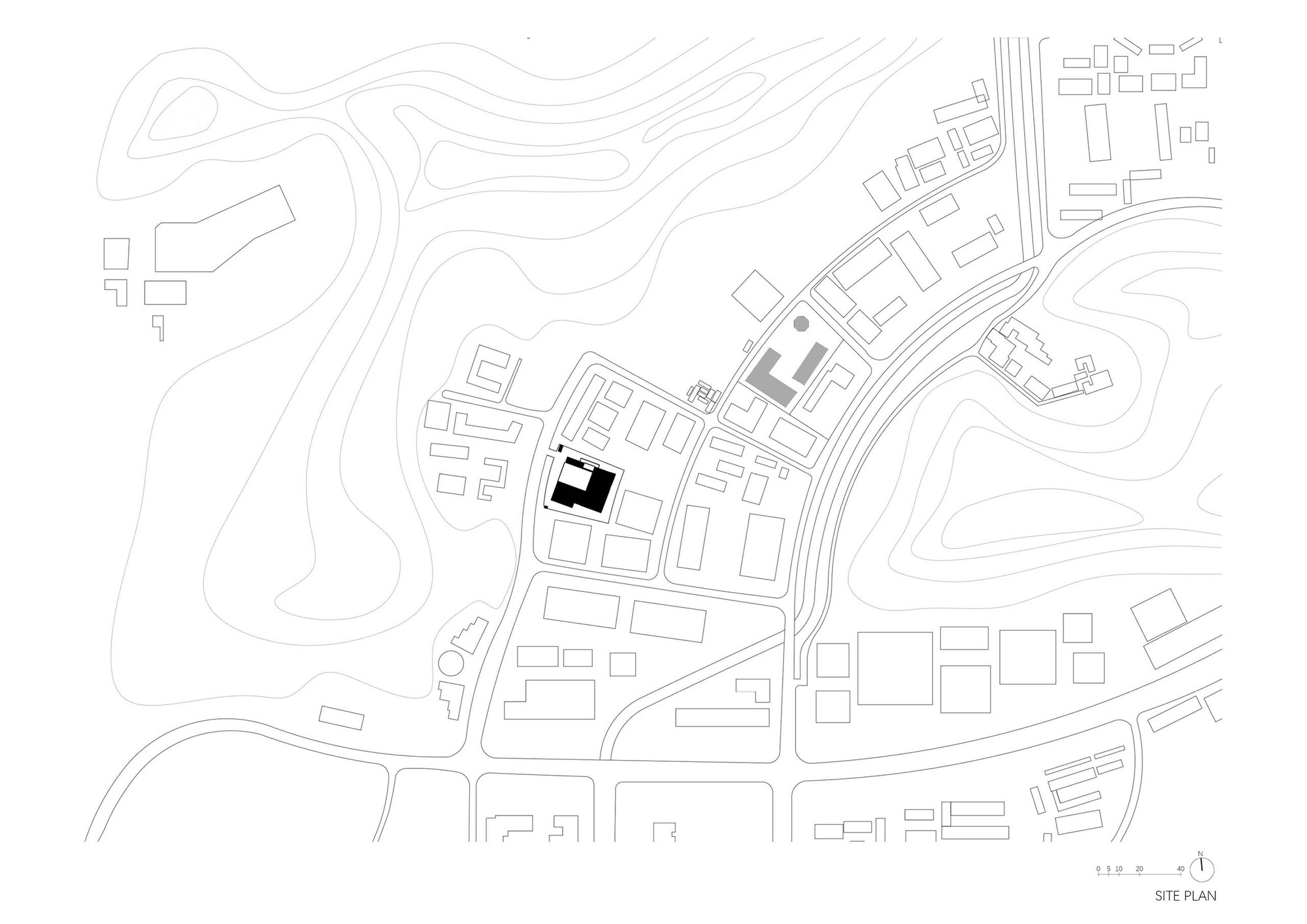 Site plan drawing showing building footprints with contour lines across the surrounding topography