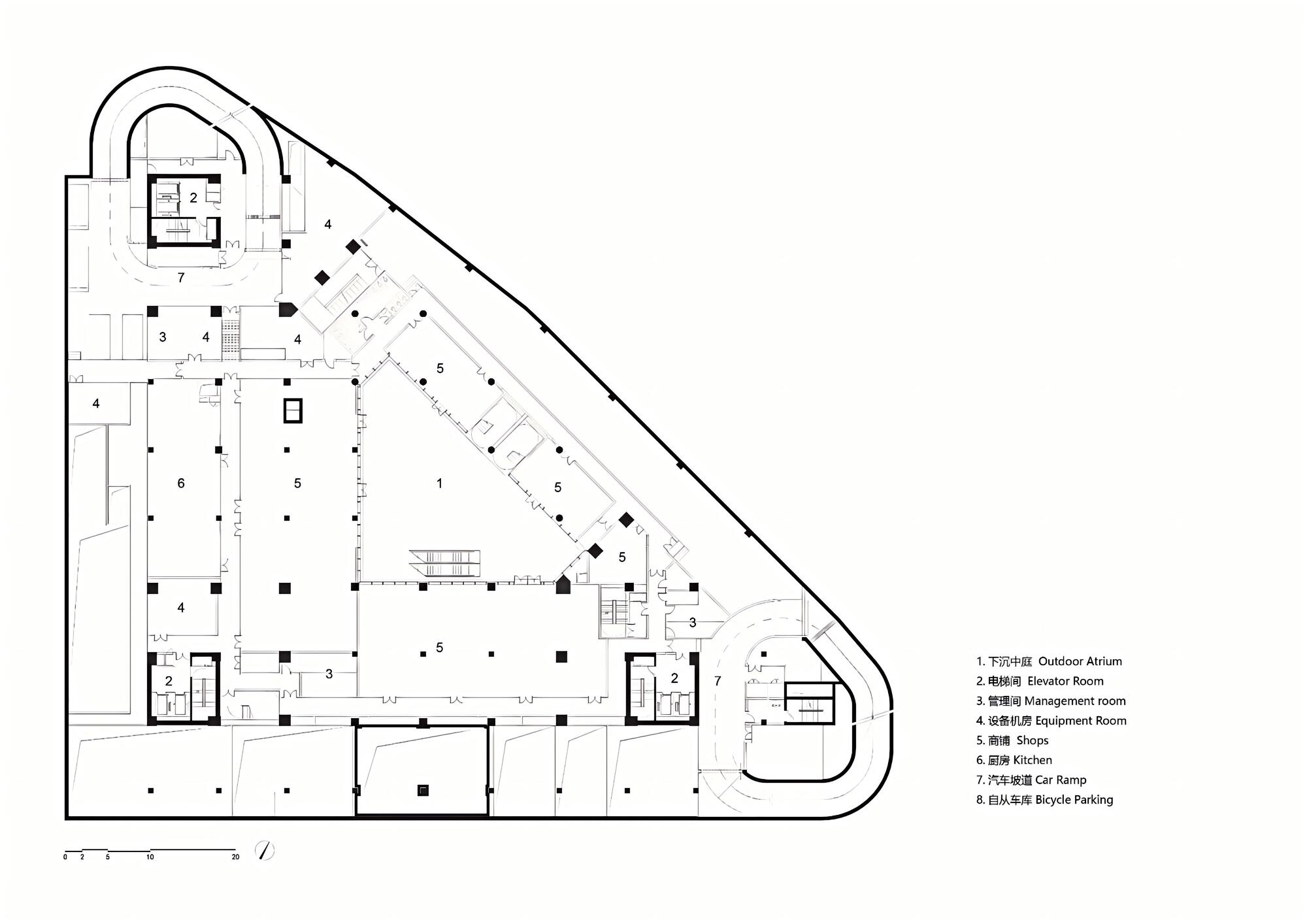 Floor plan drawing showing a triangular podium level with shops and parking circulation