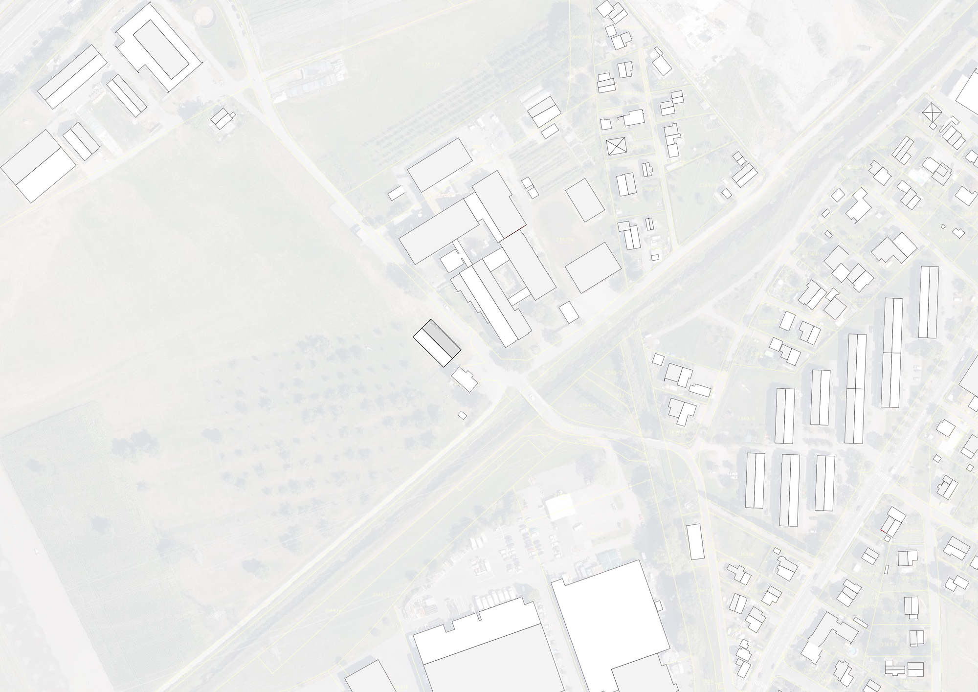 Site plan drawing showing building footprint among surrounding structures and roadways in an urban context