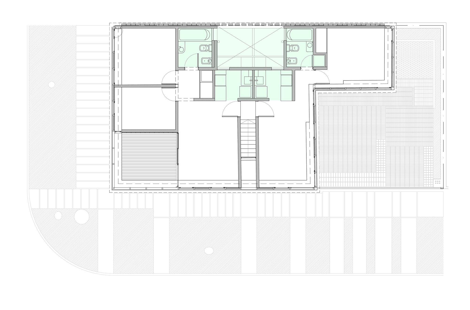 Floor plan showing upper level with central stairwell, two bathrooms, and surrounding enclosed spaces