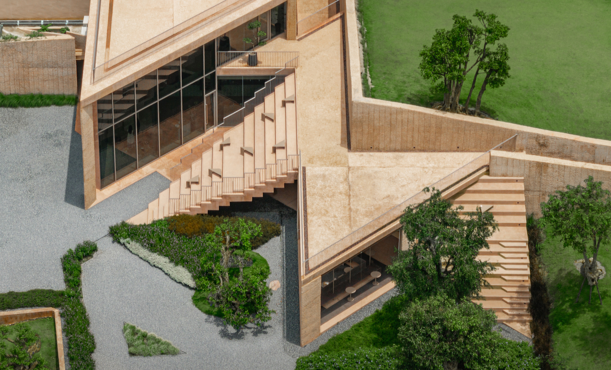 Overhead view of the courtyard with cascading stairs and planted trees between stone walls