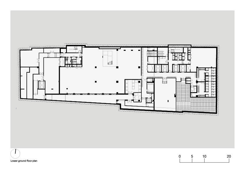 Lower ground floor plan drawing revealing two large volumes separated by circulation and support spaces