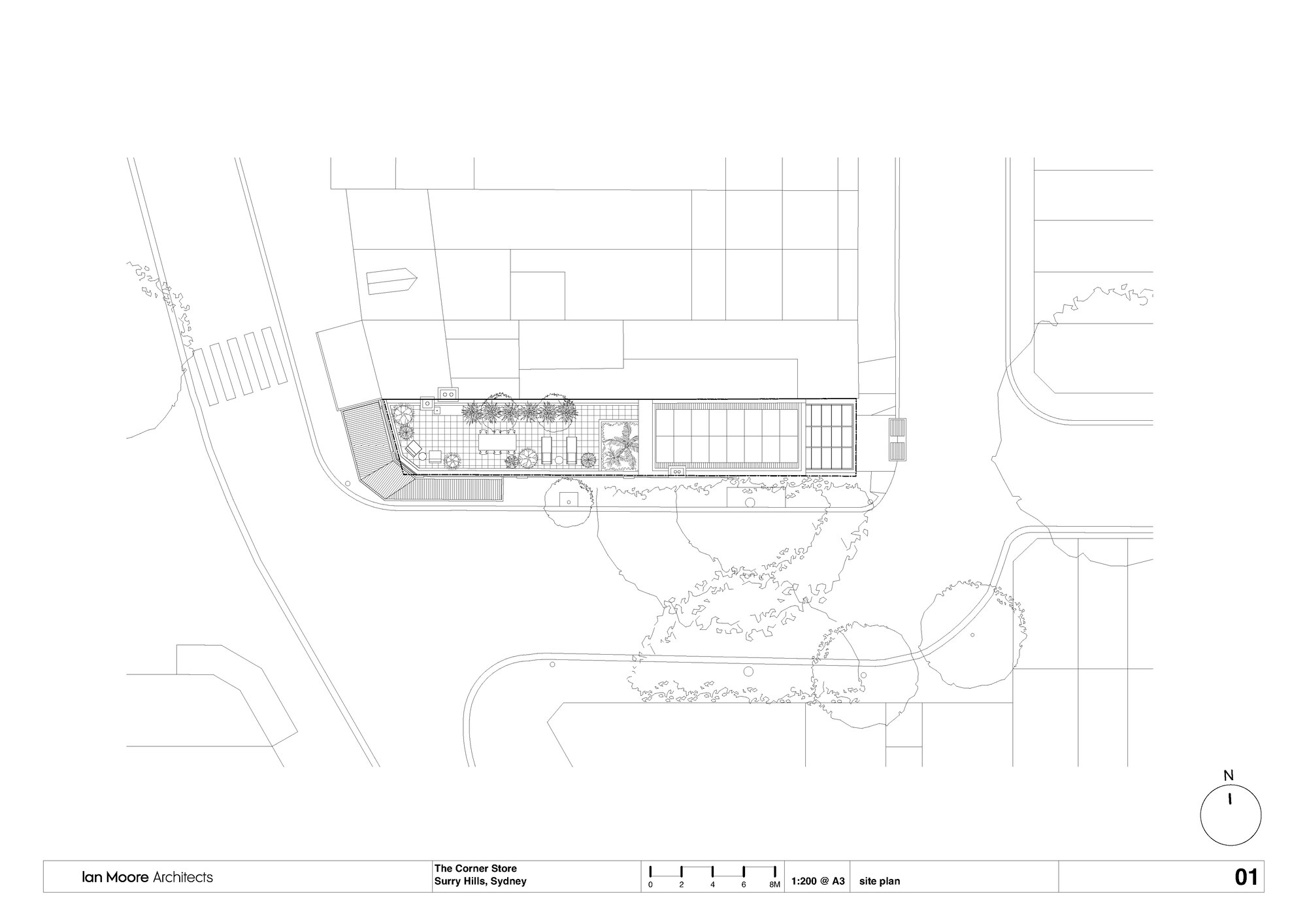 Site plan drawing showing the angled corner building footprint with street trees and adjacent structures