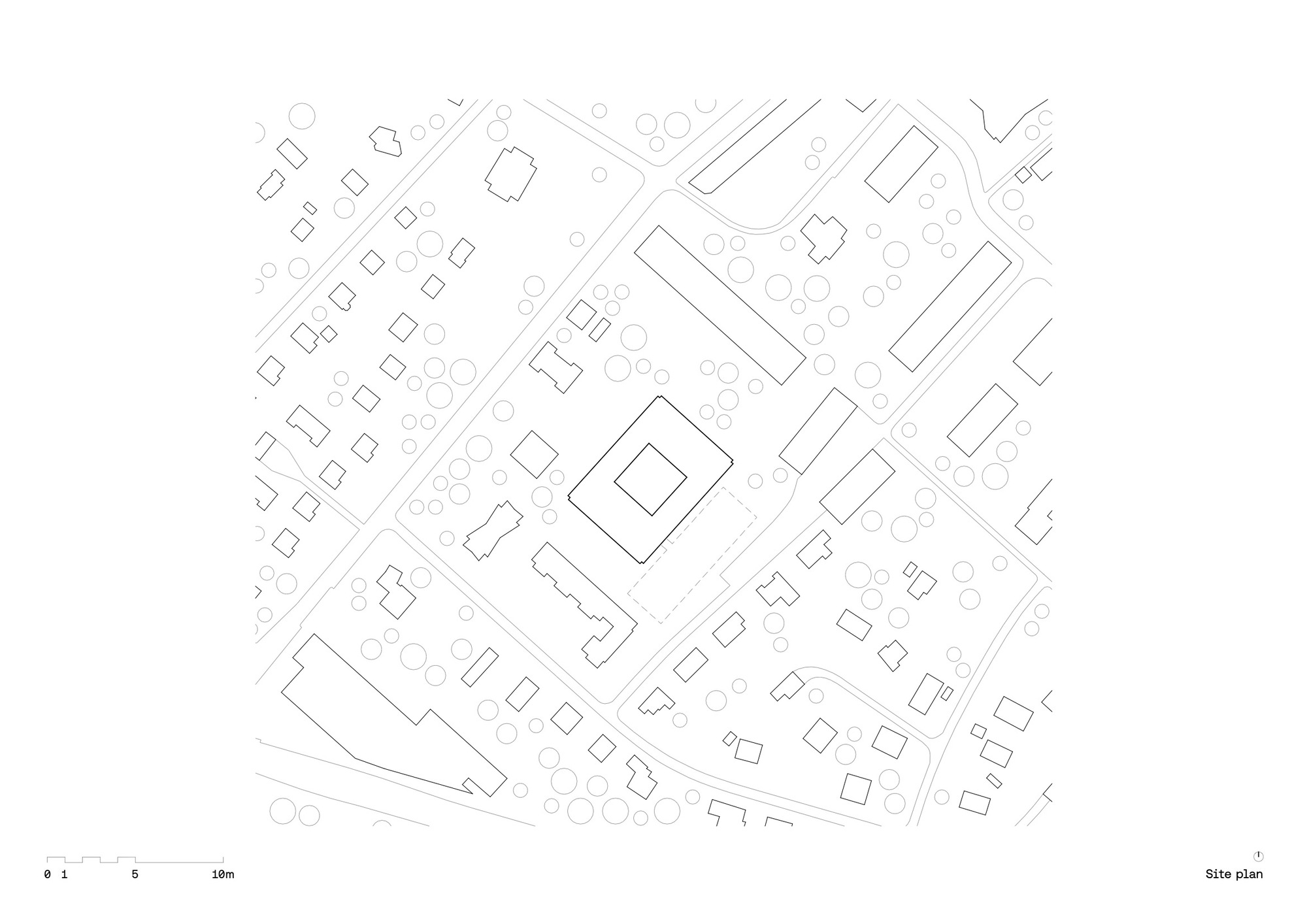 Site plan drawing showing the building footprint surrounded by existing trees and adjacent street patterns