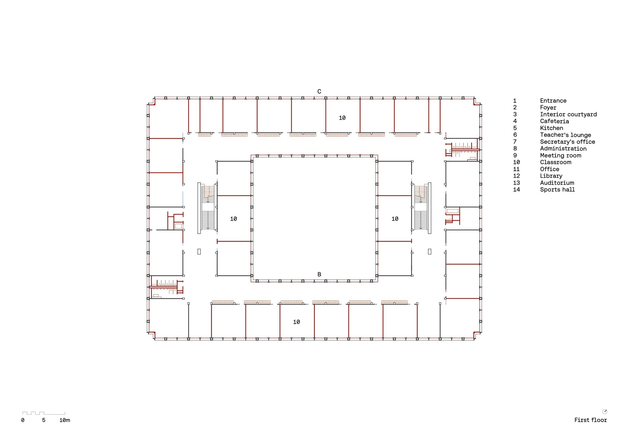 First floor plan drawing showing classrooms arranged around a central void with staircases at opposite corners