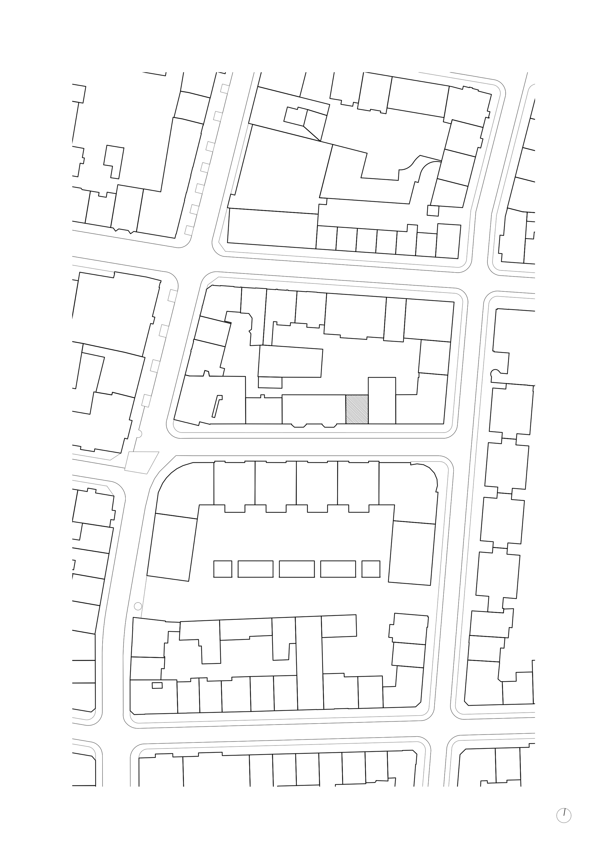 Site plan drawing showing building footprints and streets in an urban block layout