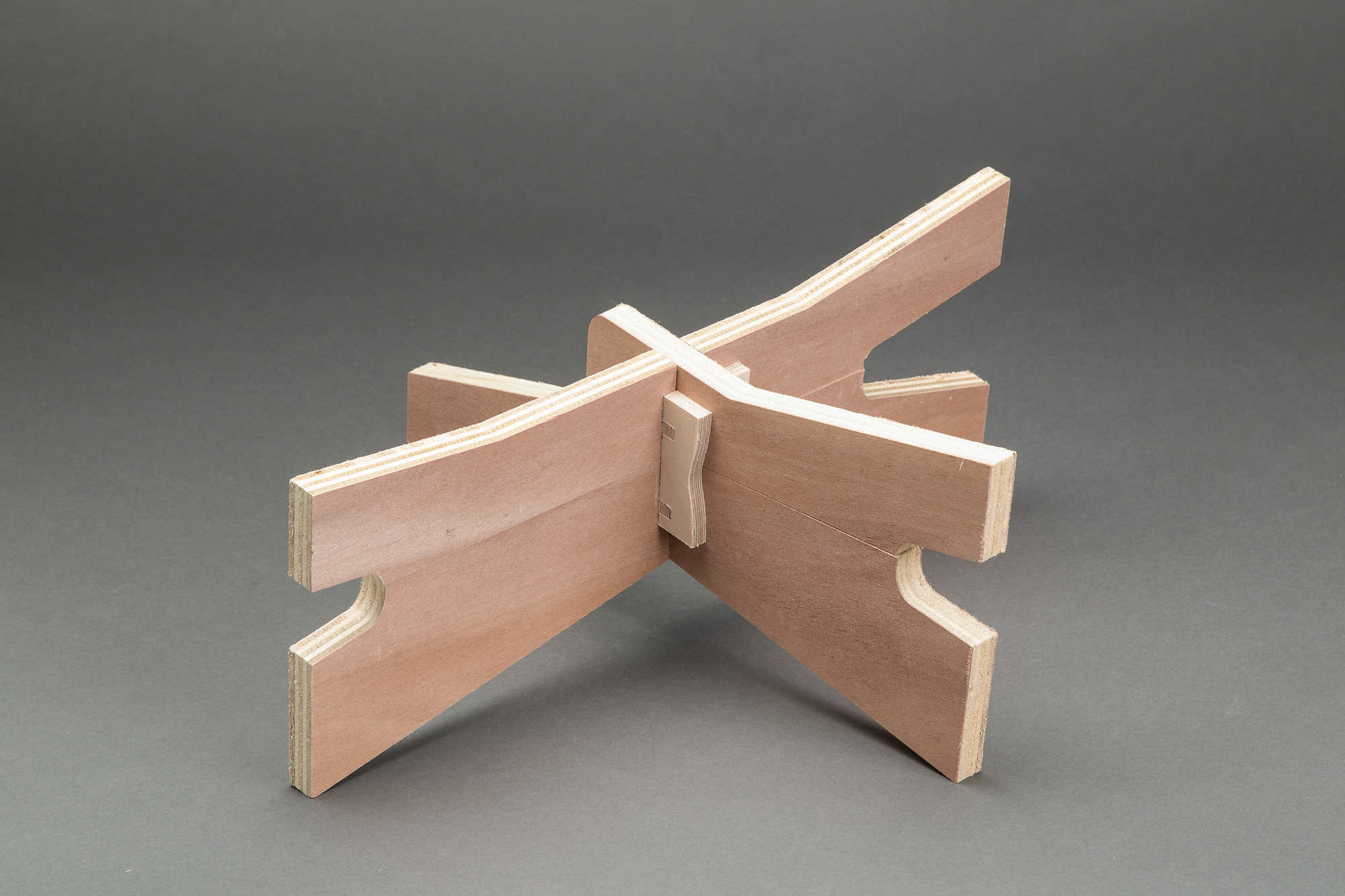 Wooden joinery detail model showing interlocking plywood panels with slotted connections