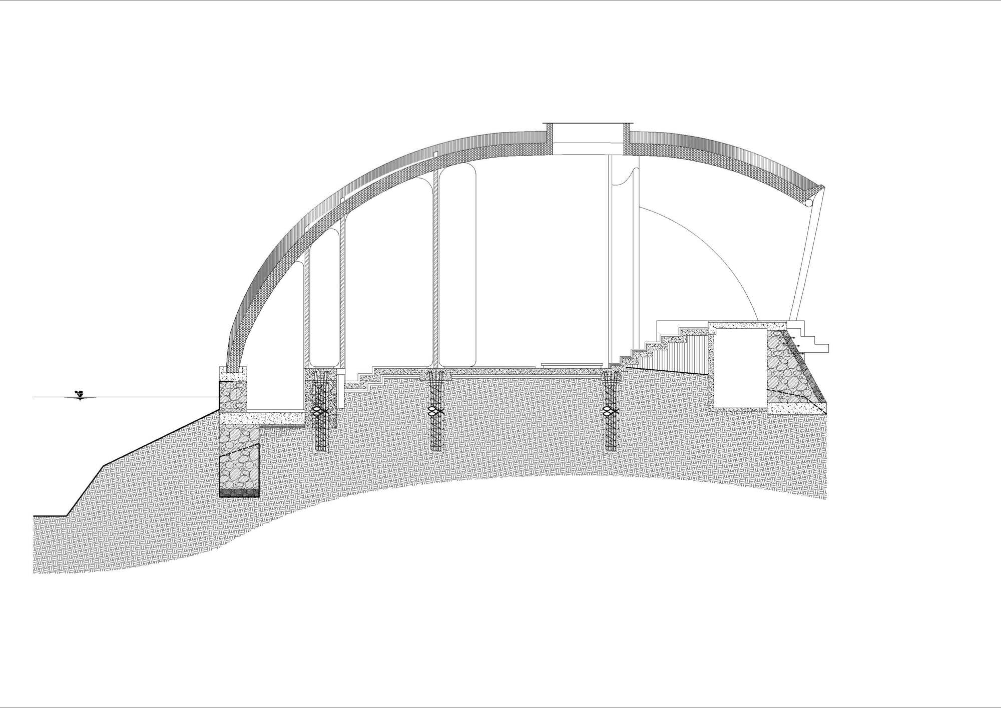 Section drawing showing the curved roof shell with suspended columns and foundation details below grade