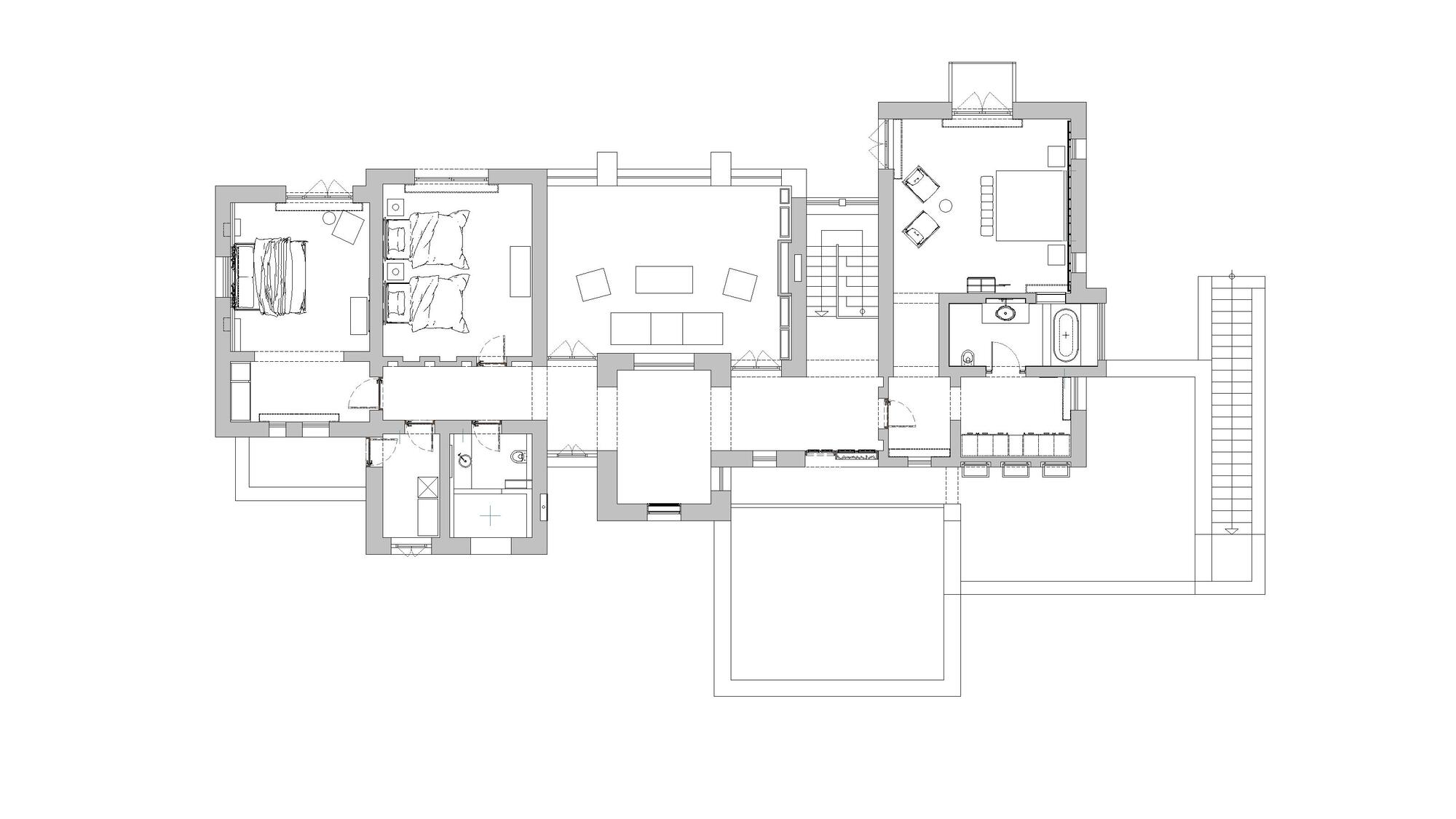 Floor plan drawing showing a residential layout with bedrooms, living areas, bathroom and exterior deck