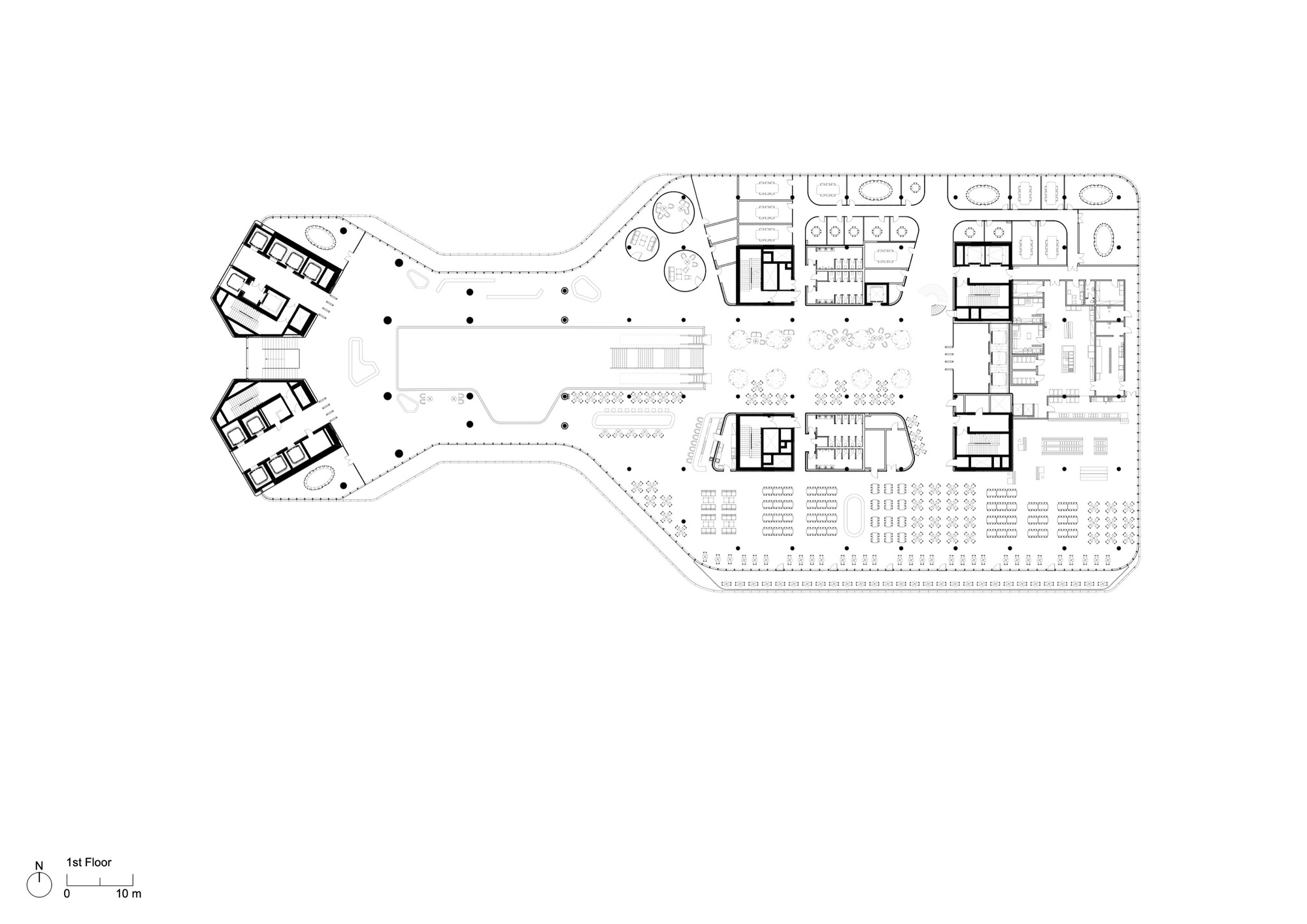 First floor plan drawing showing the irregular footprint connecting two pentagonal volumes with a retail podium