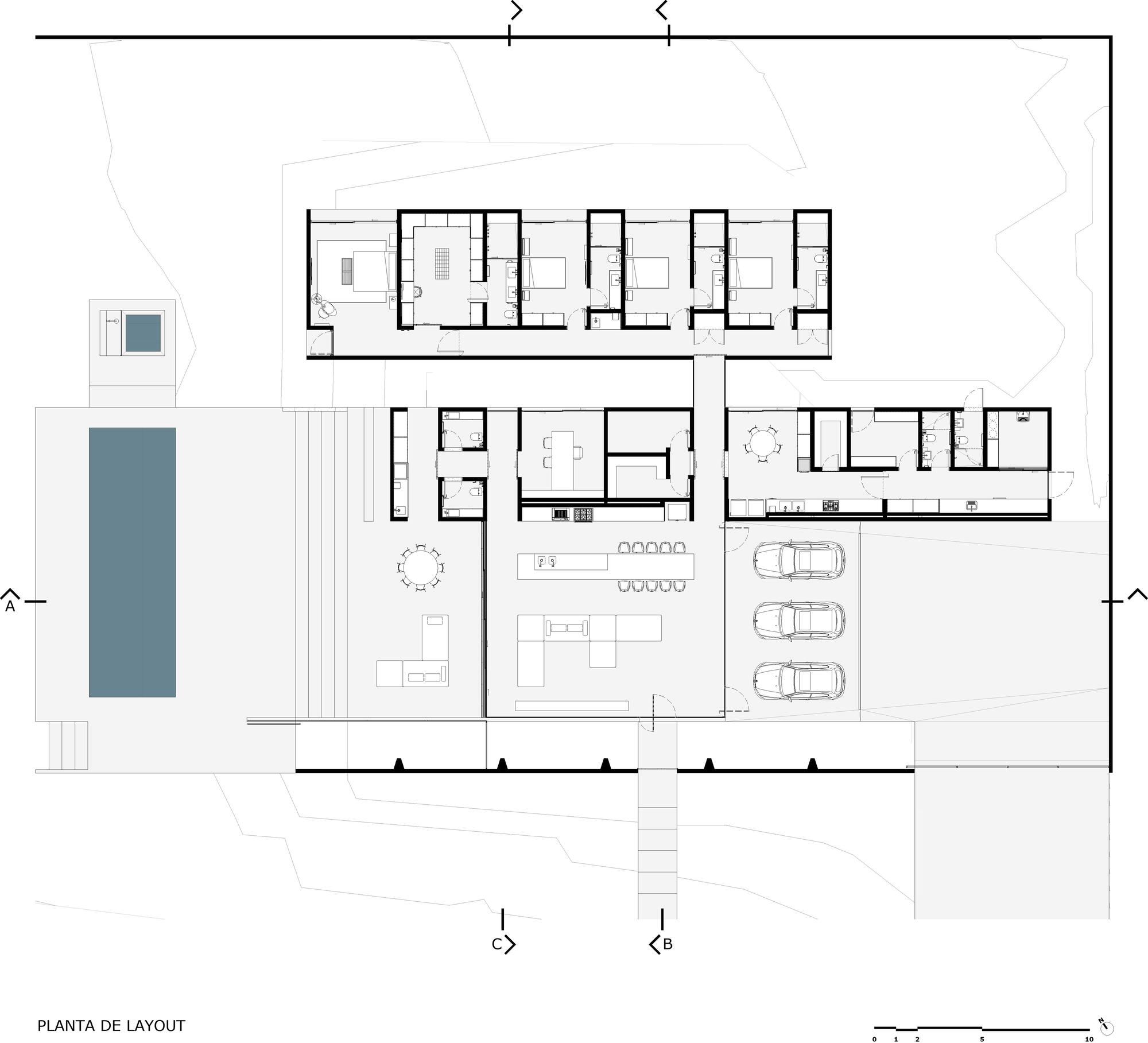 Floor plan drawing showing residential units, living spaces, garage with three cars, and pool