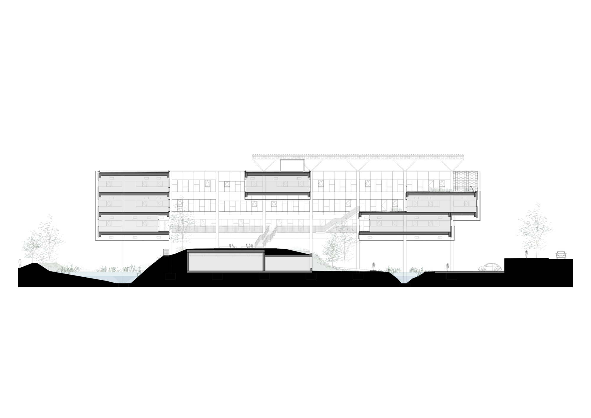 Section drawing through the building showing stacked floors above a sunken below-grade space with trees