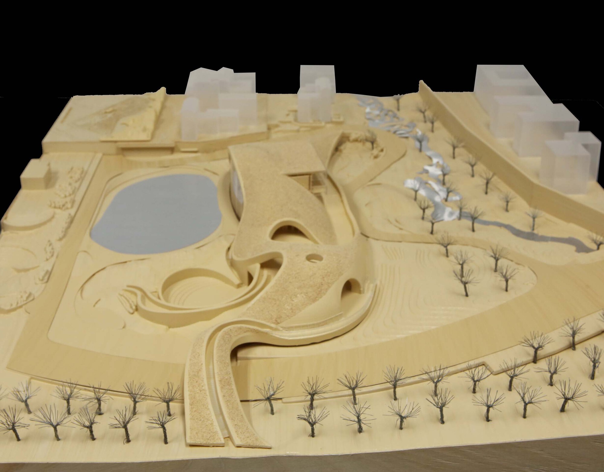 Physical site model showing the flowing roof forms with rows of miniature trees