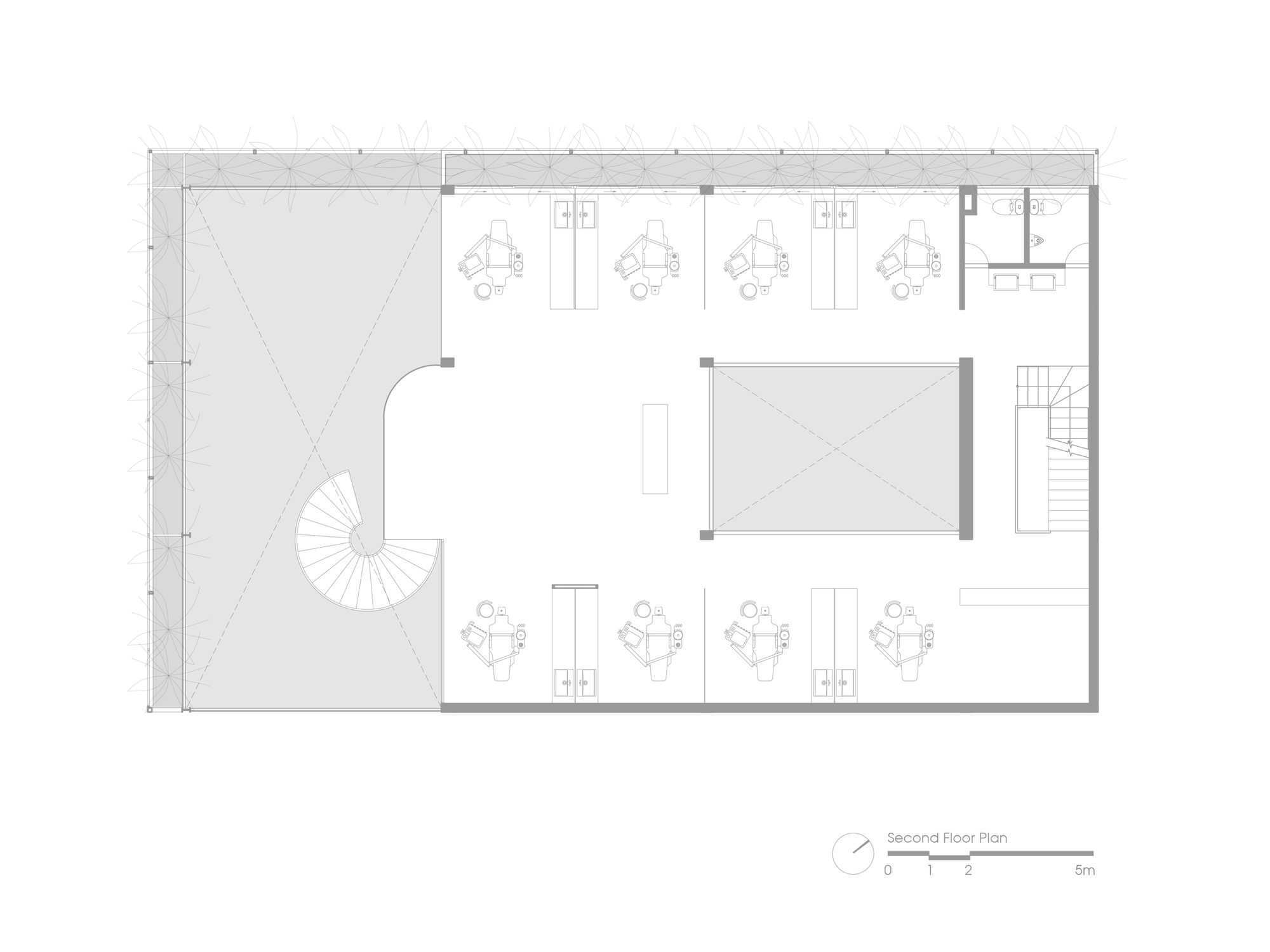 Second floor plan drawing showing workstations and a central enclosed room with spiral stair