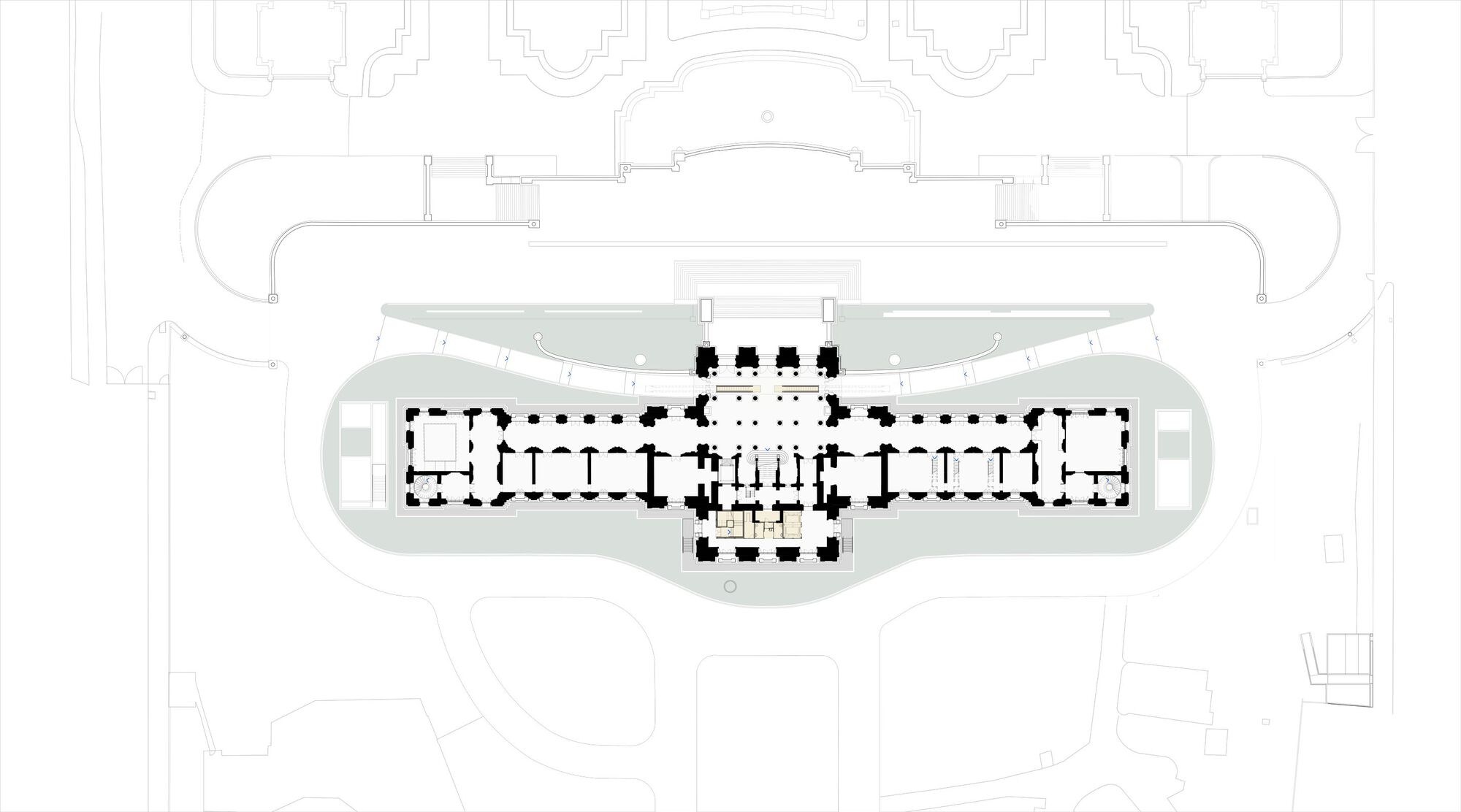 Plan drawing showing a symmetrical layout with central hall and curved underground extension at grade level
