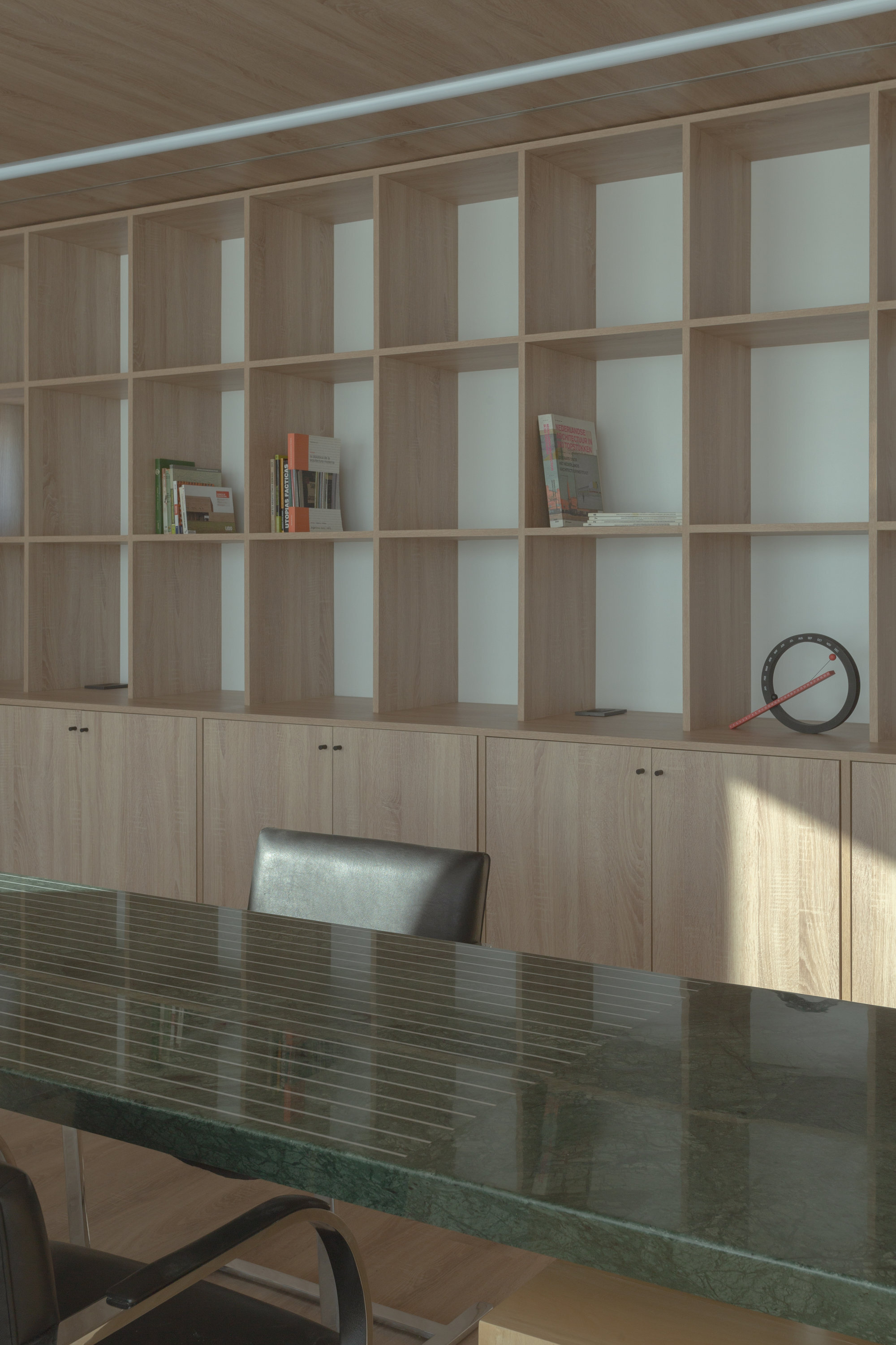 Green stone desk surface against timber shelving wall with afternoon sunlight casting shadows
