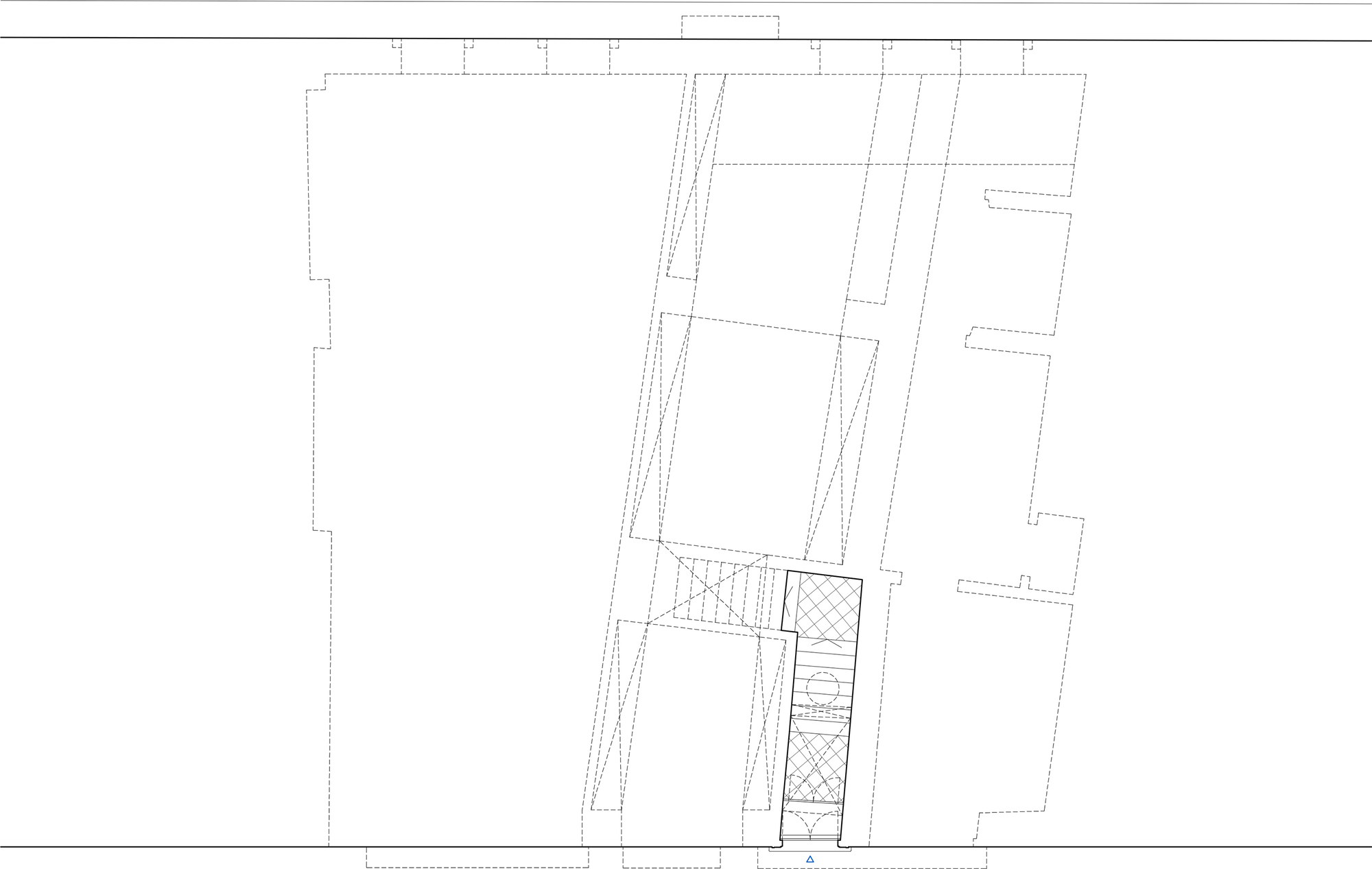 Floor plan drawing showing an angular layout with stairs and courtyard spaces