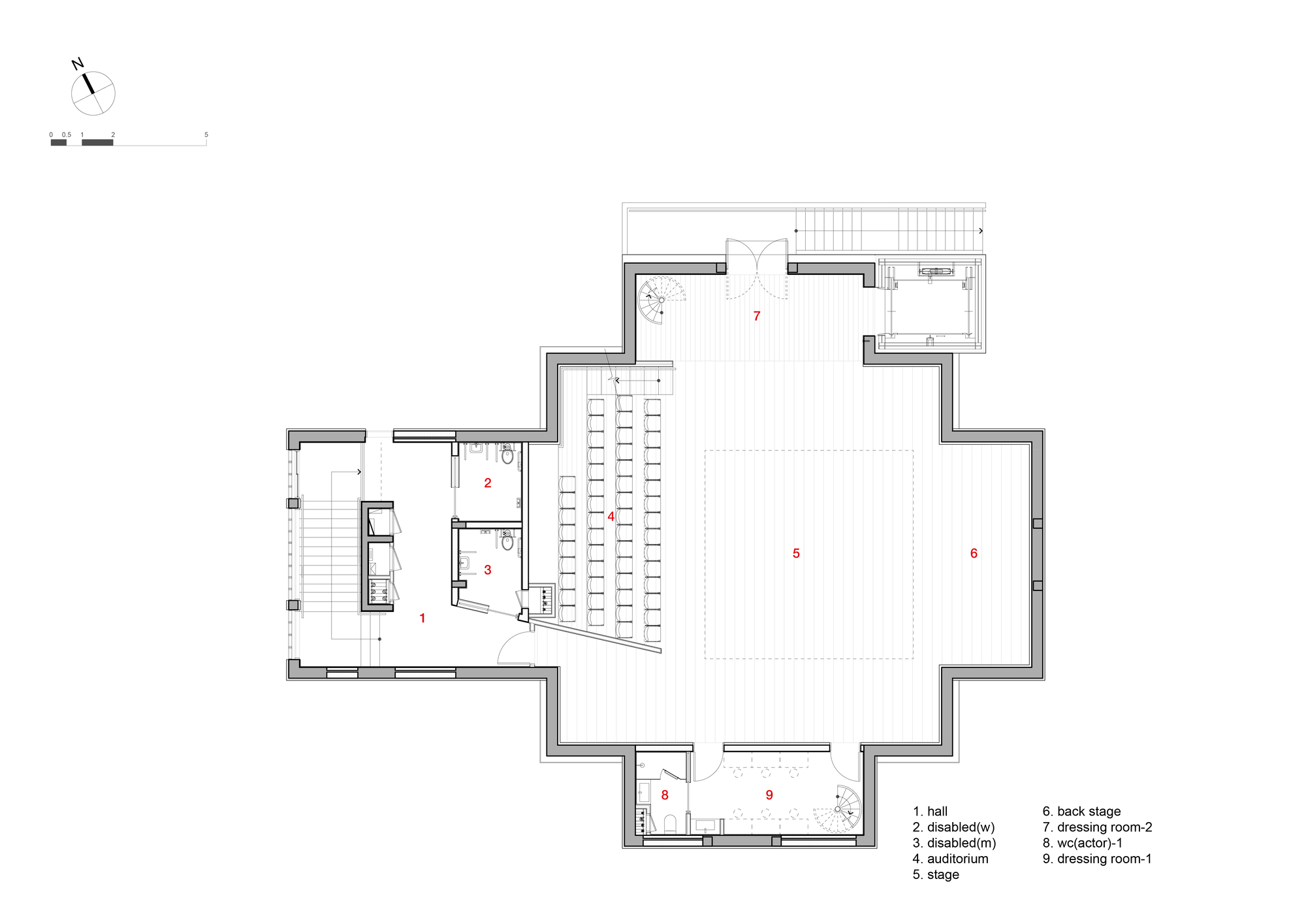 Floor plan showing an auditorium with seating rows and adjacent accessible facilities with circulation stair