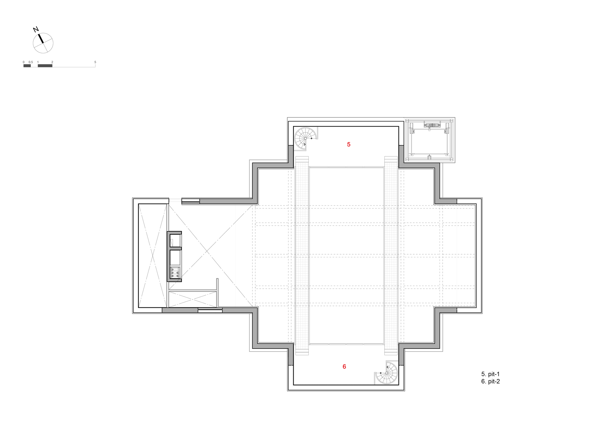 Floor plan showing open performance space with flanking circulation zones and adjacent lift core