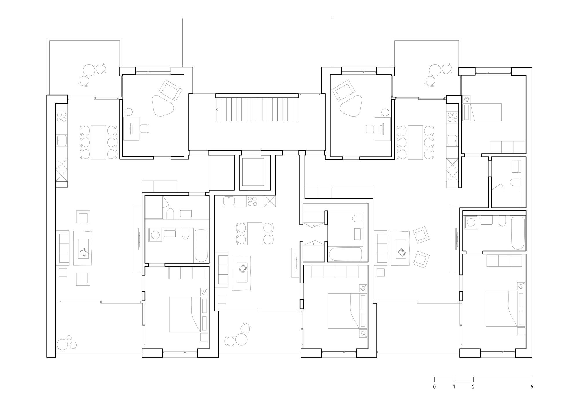 Floor plan drawing depicting dwelling units with open-plan living areas and private balconies