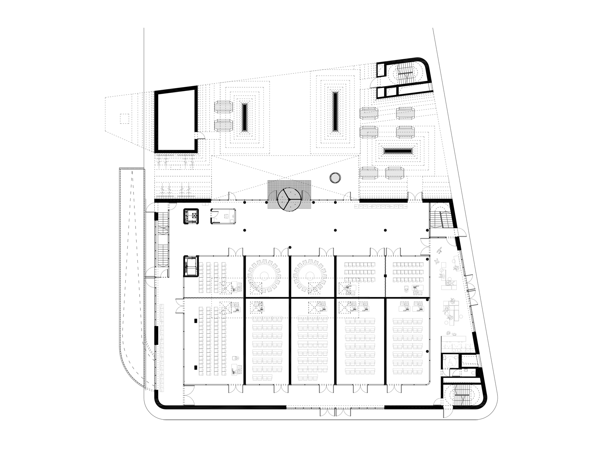 Floor plan drawing showing parking zone with rows of spaces and central circular stair core