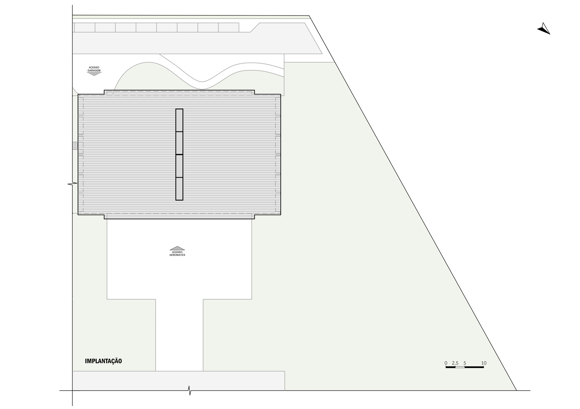 Site plan showing the hangar building with curved roof and surrounding apron area