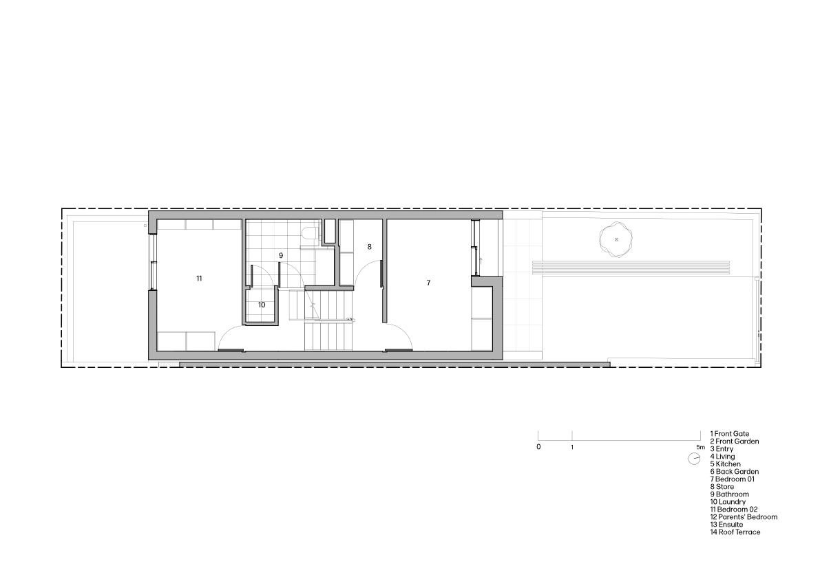 First floor plan showing bedroom, bathroom, and staircase in a narrow elongated layout