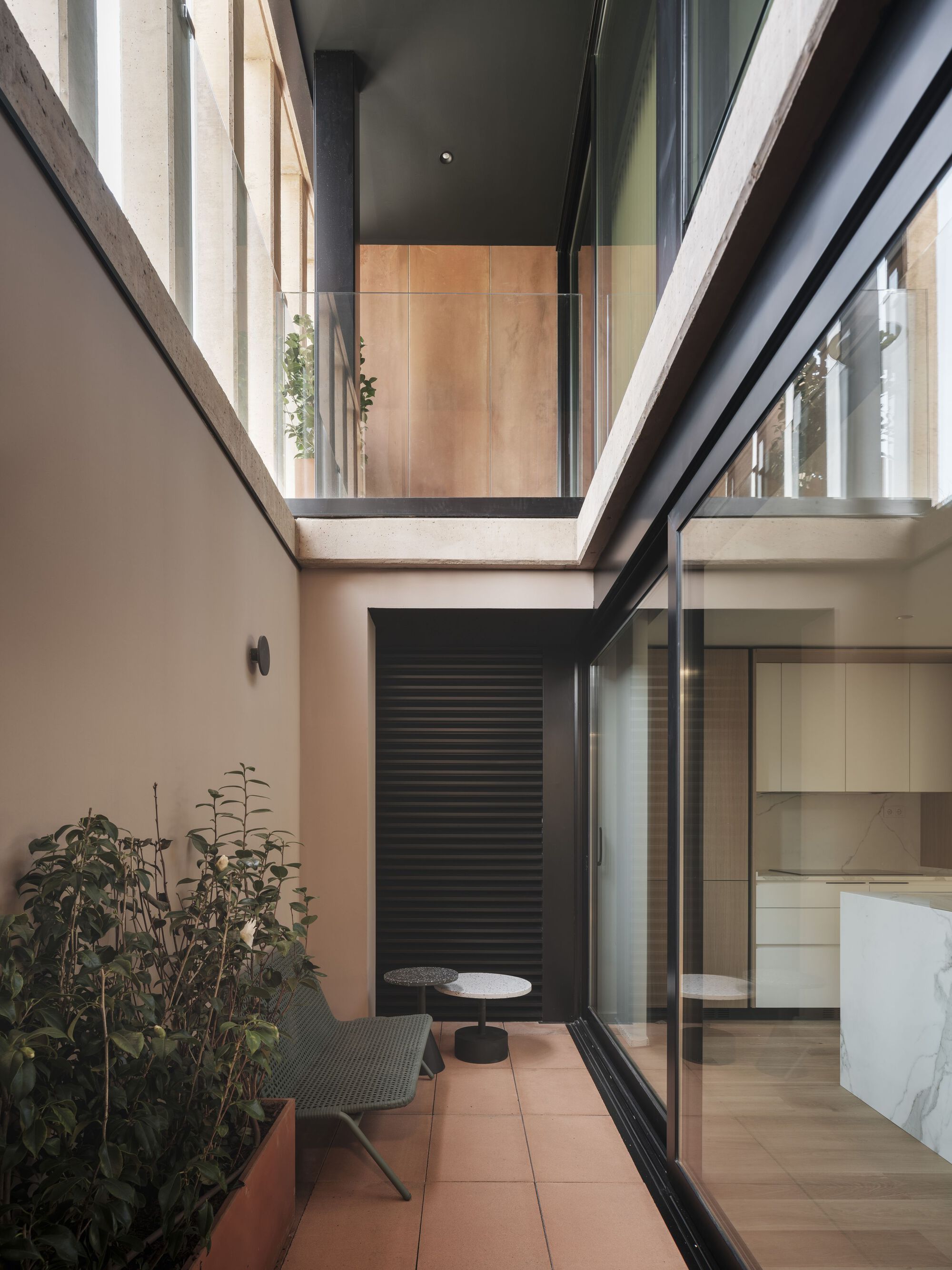 Private terrace with skylight above and glazed sliding door opening to the kitchen