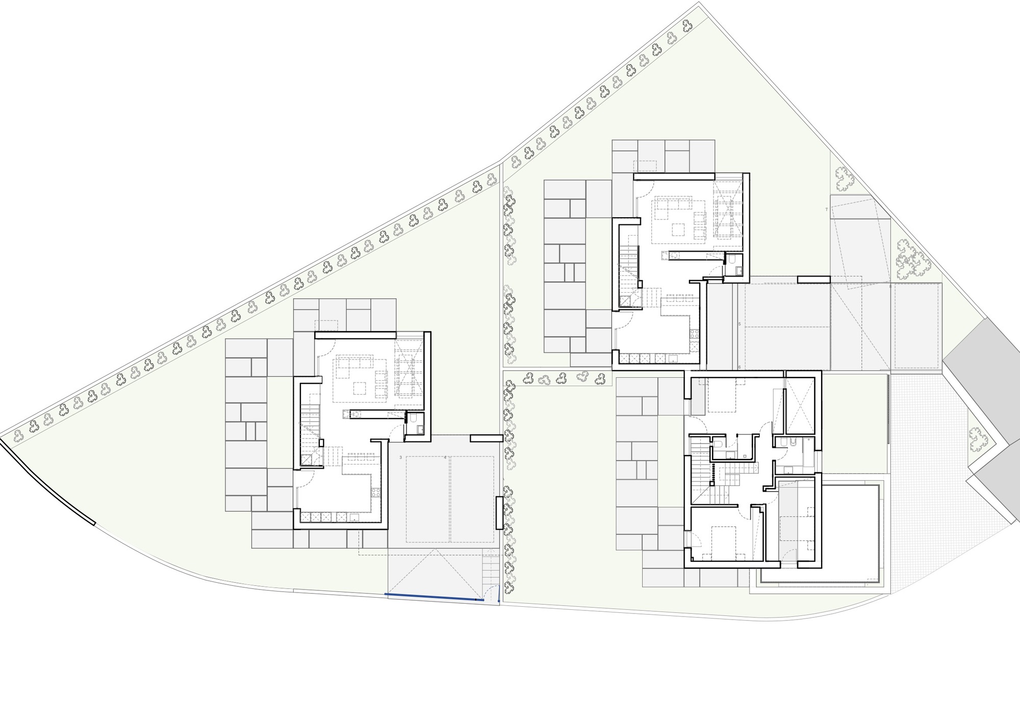 Site plan drawing showing two residential buildings with courtyards on a sloping trapezoidal lot