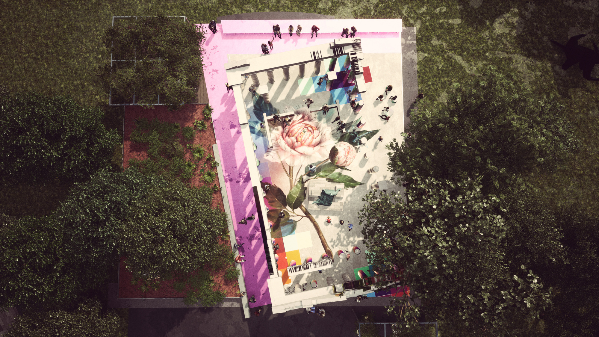 Aerial view of the painted plaza floor showing a large floral mural surrounded by dense tree canopy