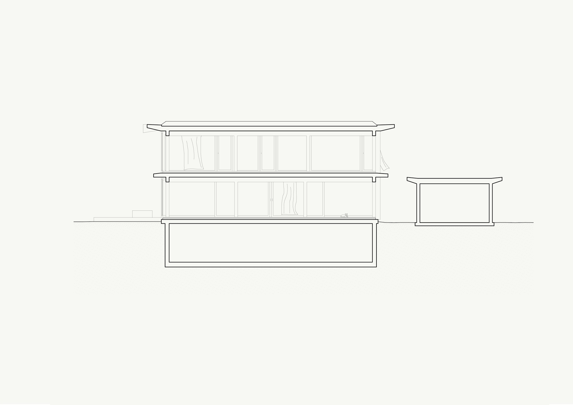 Section drawing revealing two-story volume with basement and single-story adjacent structure