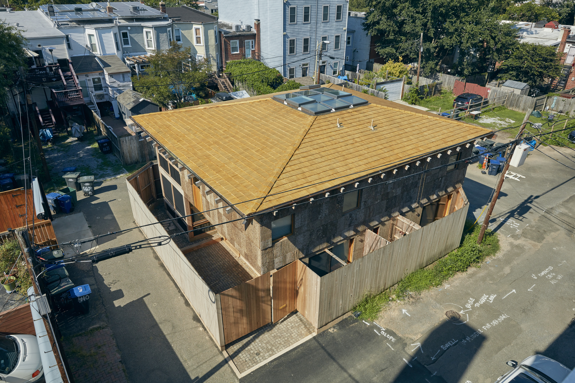 Aerial view of the butterfly roof with exposed timber joists above the residential street