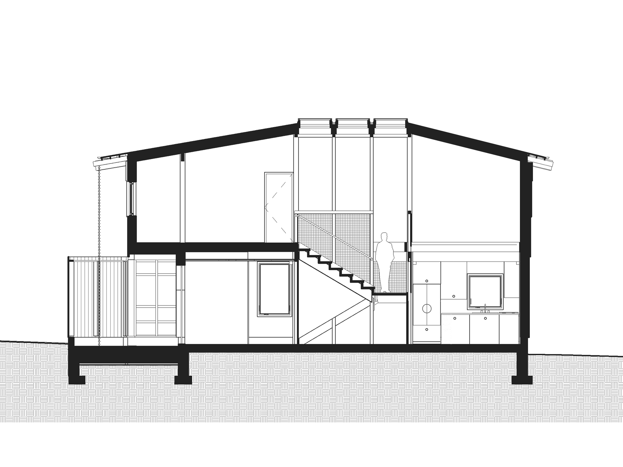 Section drawing showing the sloped roof structure and central staircase with a figure for scale