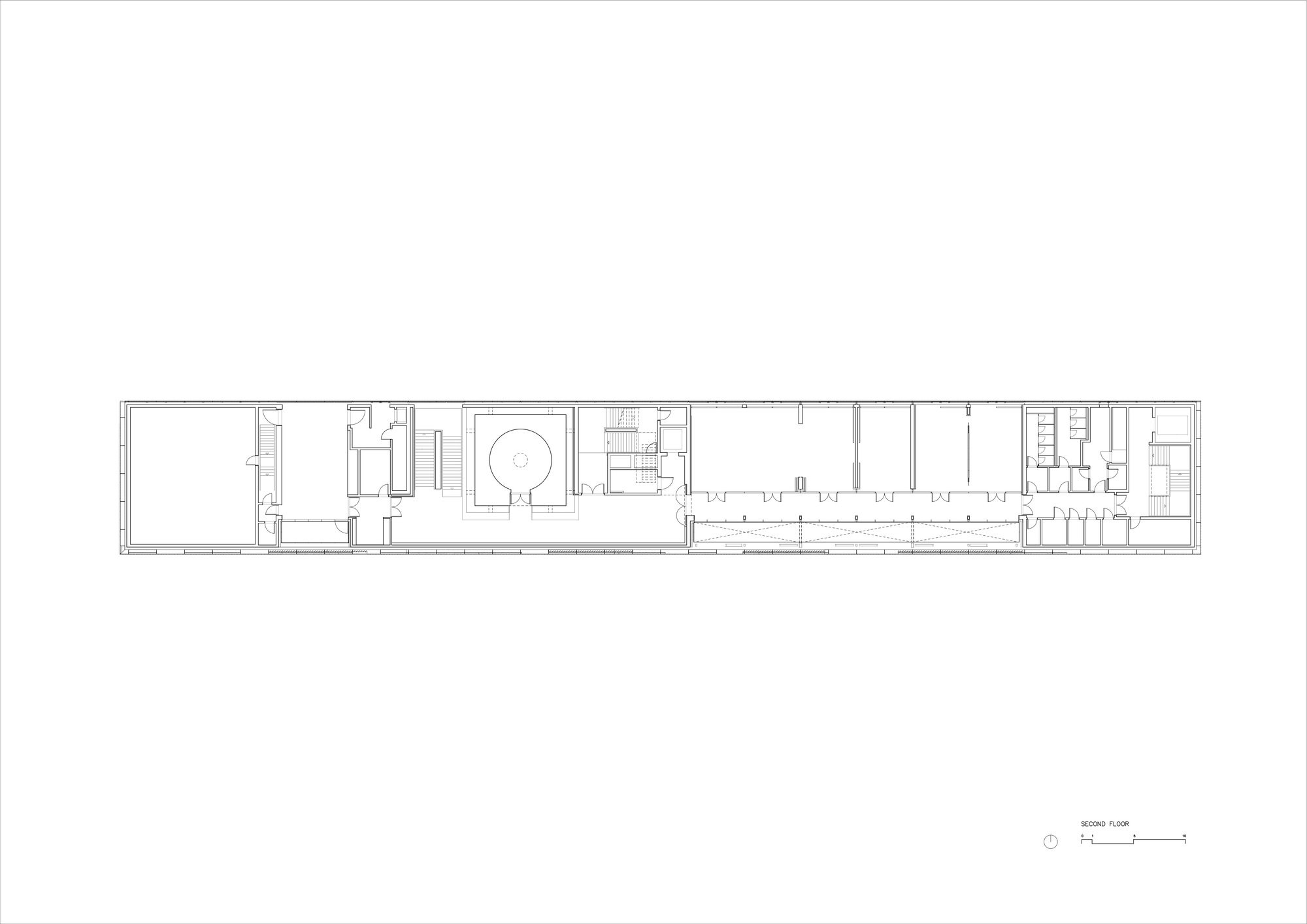 Second floor plan drawing showing narrow linear organization with central circulation spine