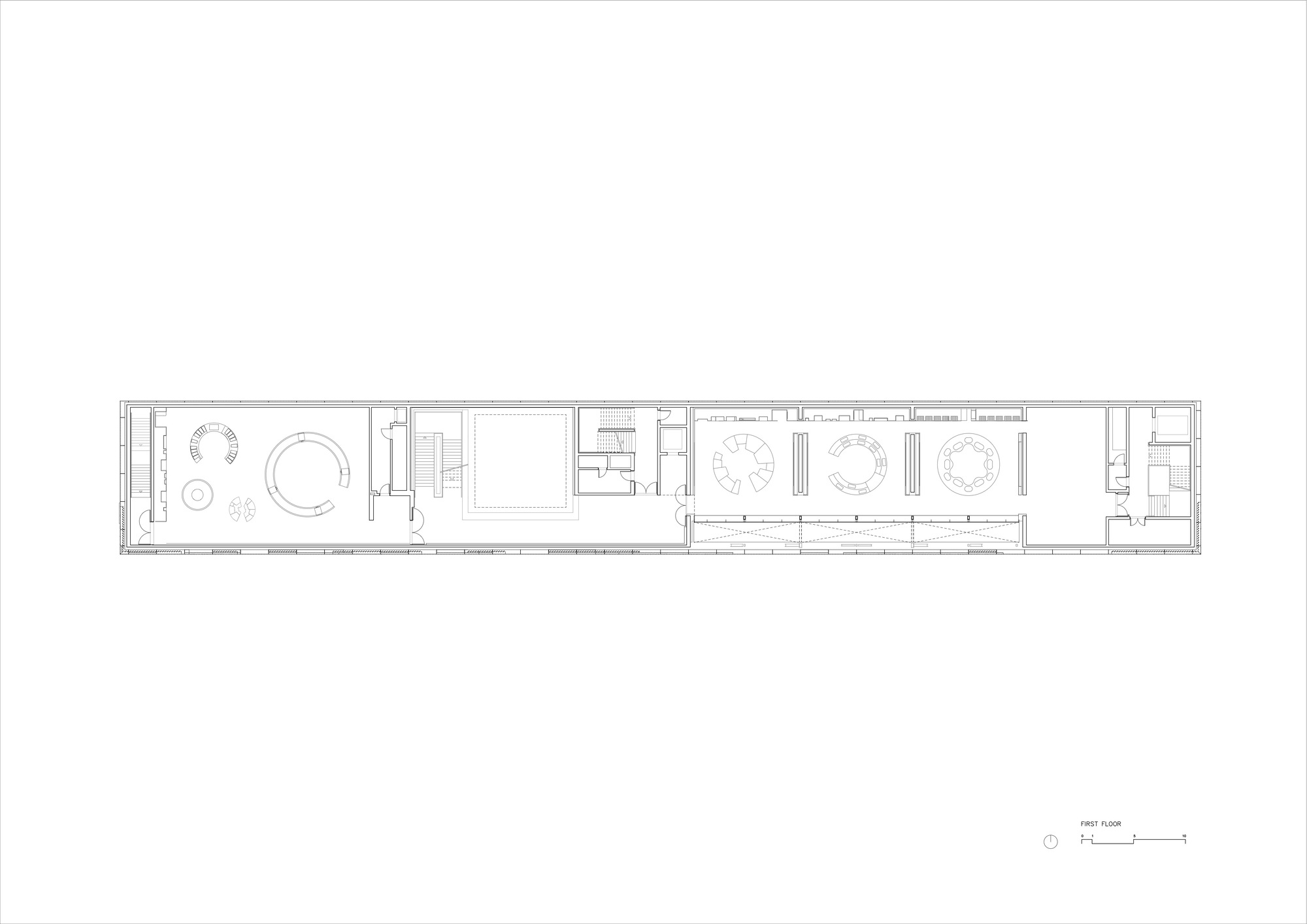 Floor plan drawing showing a long narrow volume with circular meeting spaces and rows of workstations