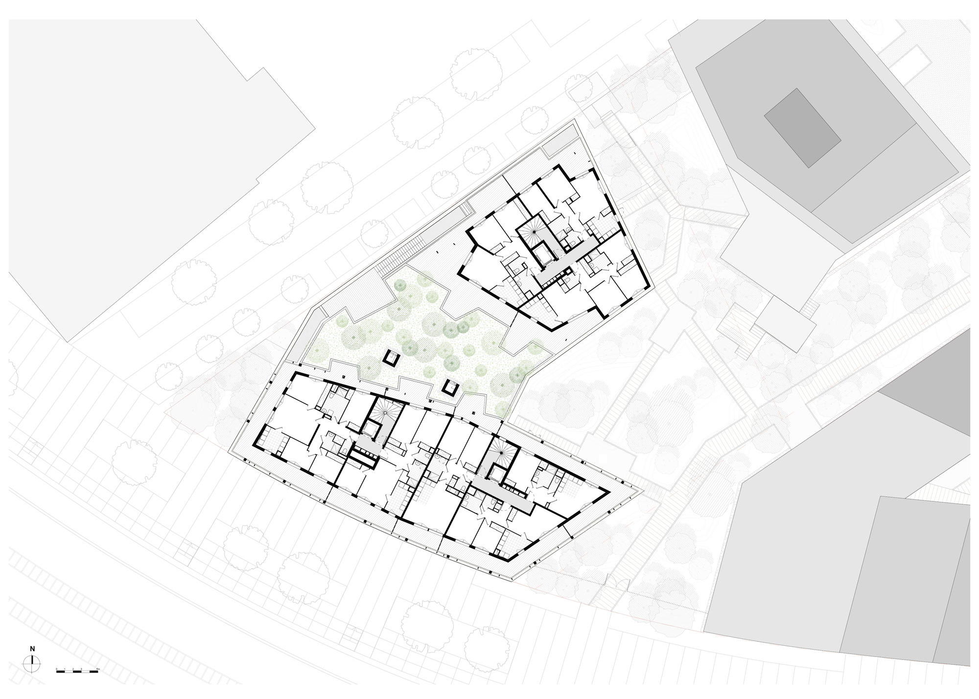 Upper floor plan drawing showing residential units flanking a central landscaped courtyard with trees