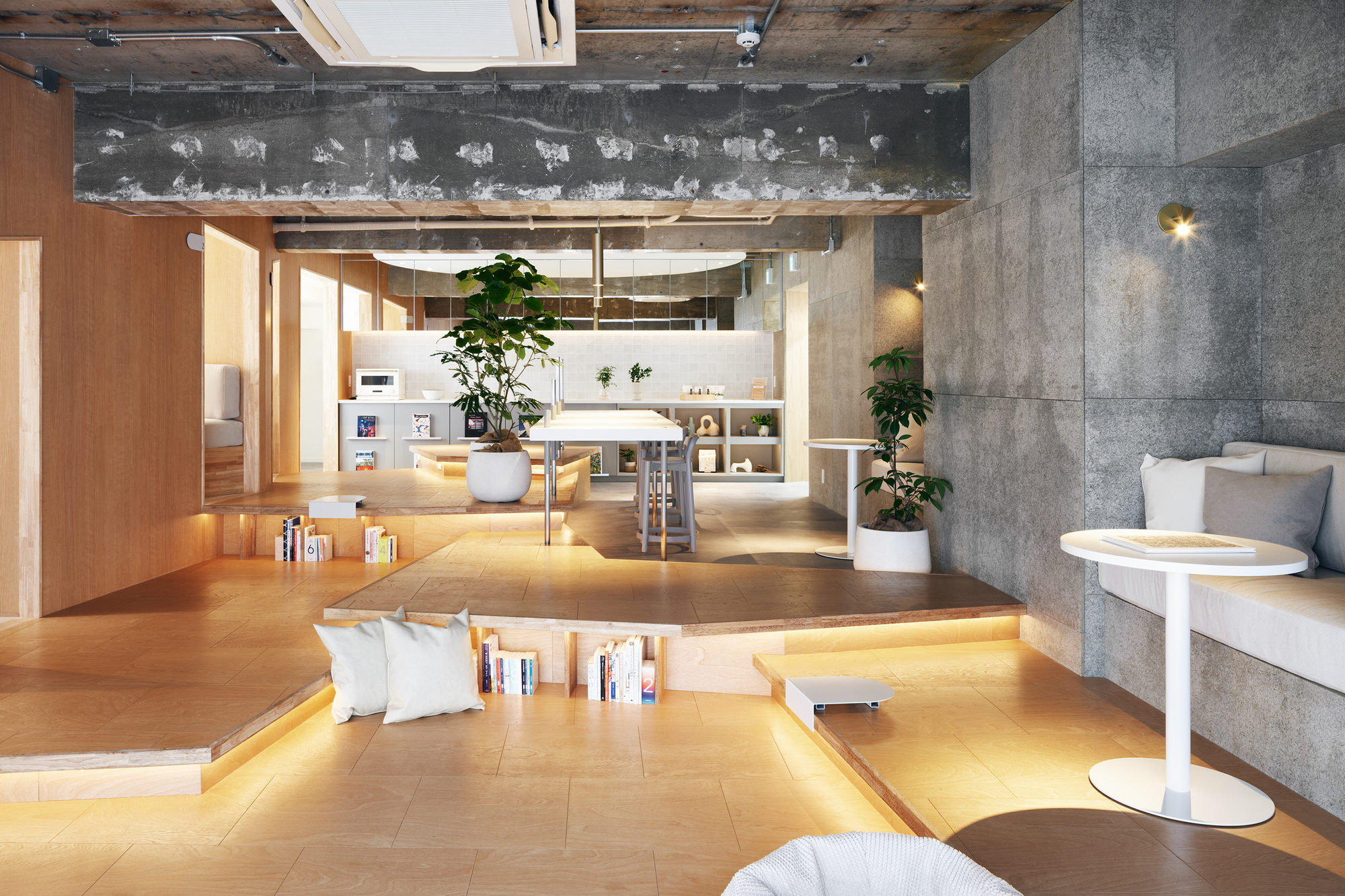 Sunken plywood lounge area with integrated book storage and pendant lighting overhead