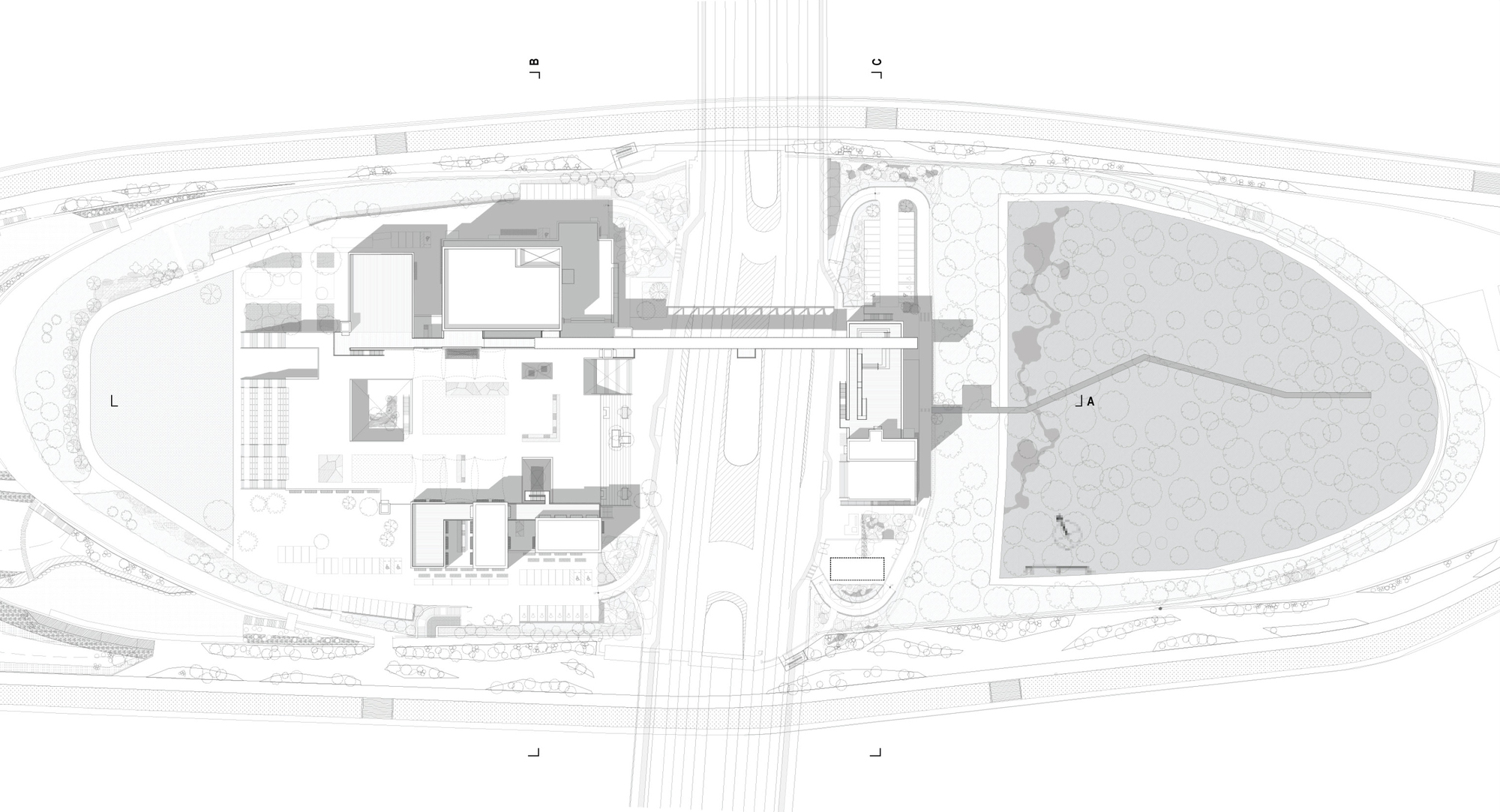 Site plan drawing showing building clusters bisected by a central roadway and adjacent park