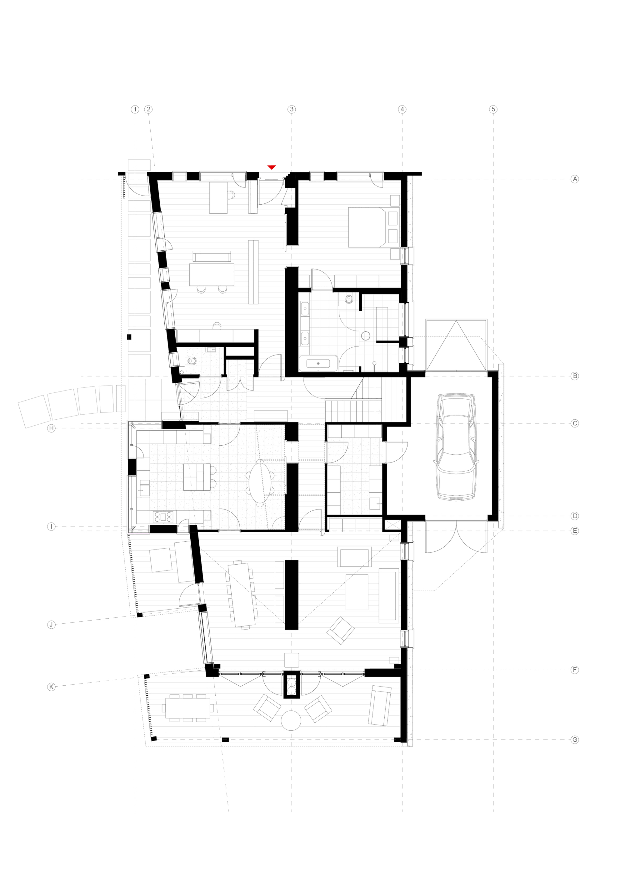 Floor plan drawing showing residential spaces with thick walls and a carport to the right