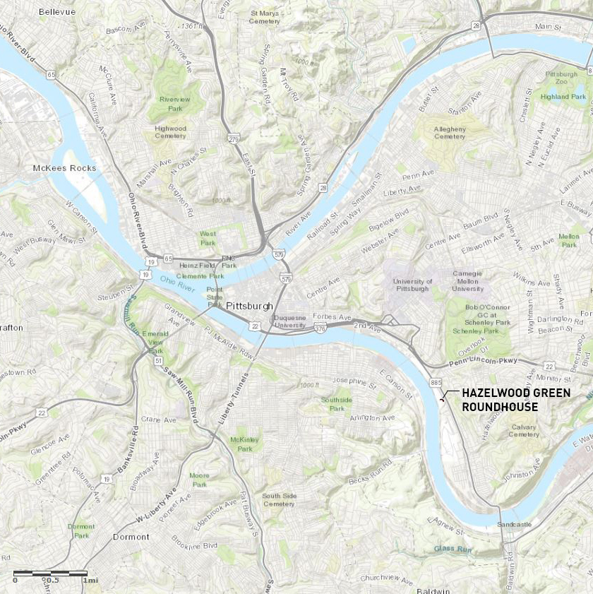 Site map showing the building location along a river bend with surrounding parks and roadways