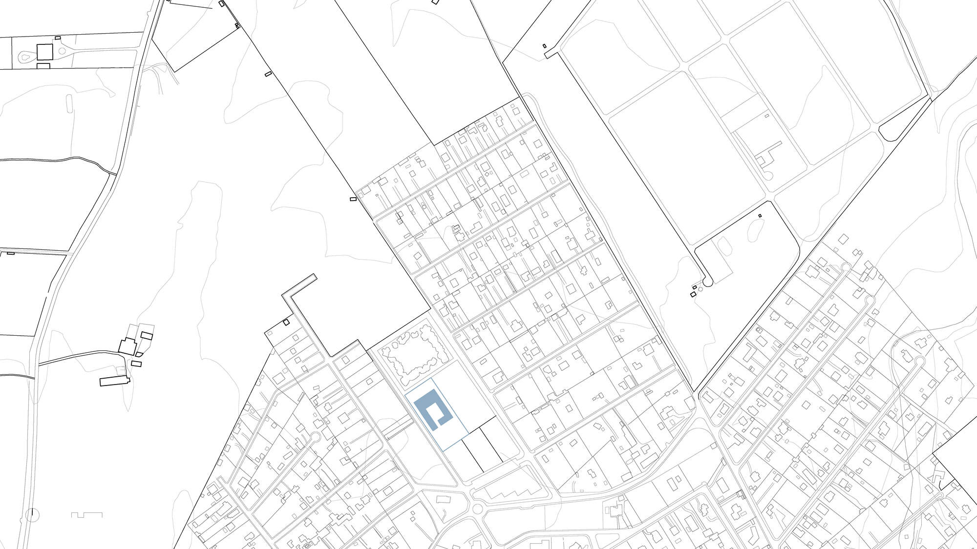 Site plan drawing showing a rectangular building footprint within a diagonal urban street grid