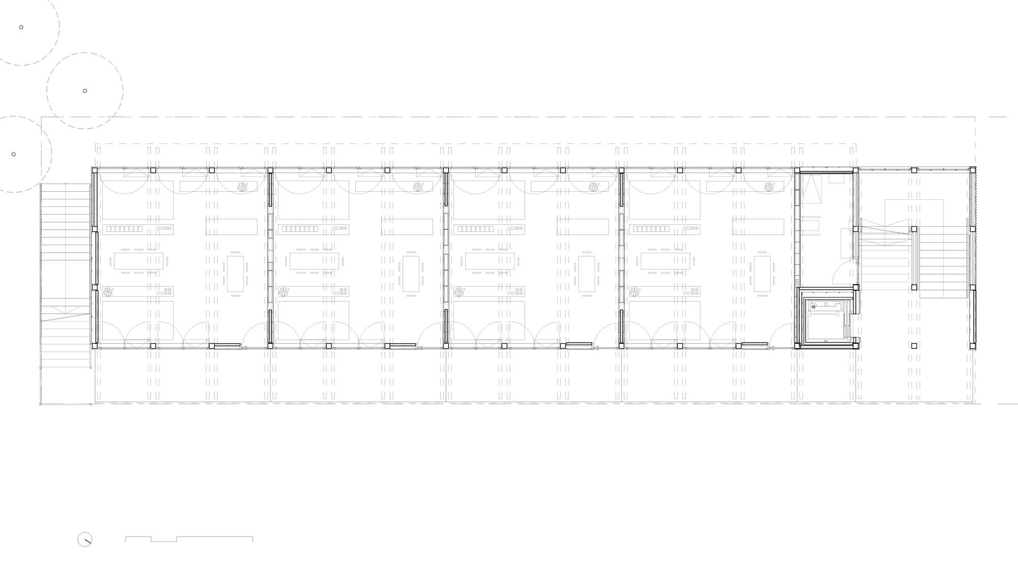 Floor plan drawing of a narrow rectangular building with repeated structural bays and modular rooms