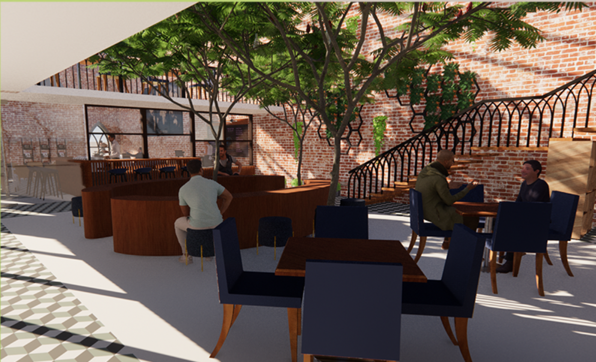 A lush central courtyard brings nature into the heart of the café, offering a tranquil setting for gathering, relaxation, and conversation.