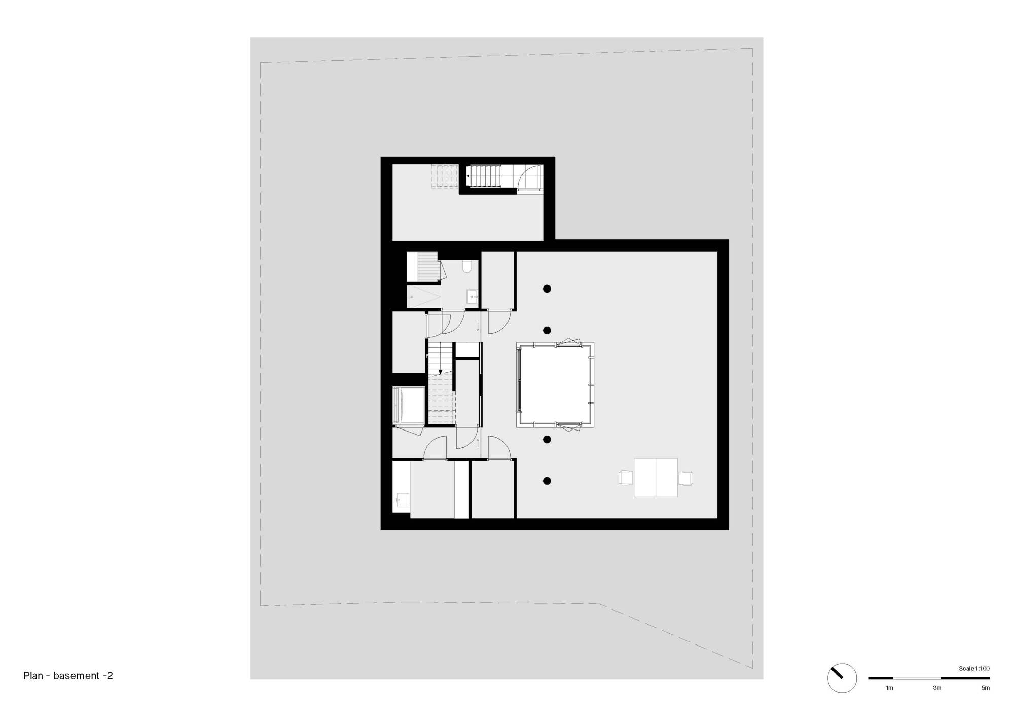 Basement level floor plan showing bathroom clusters and open living area with stair