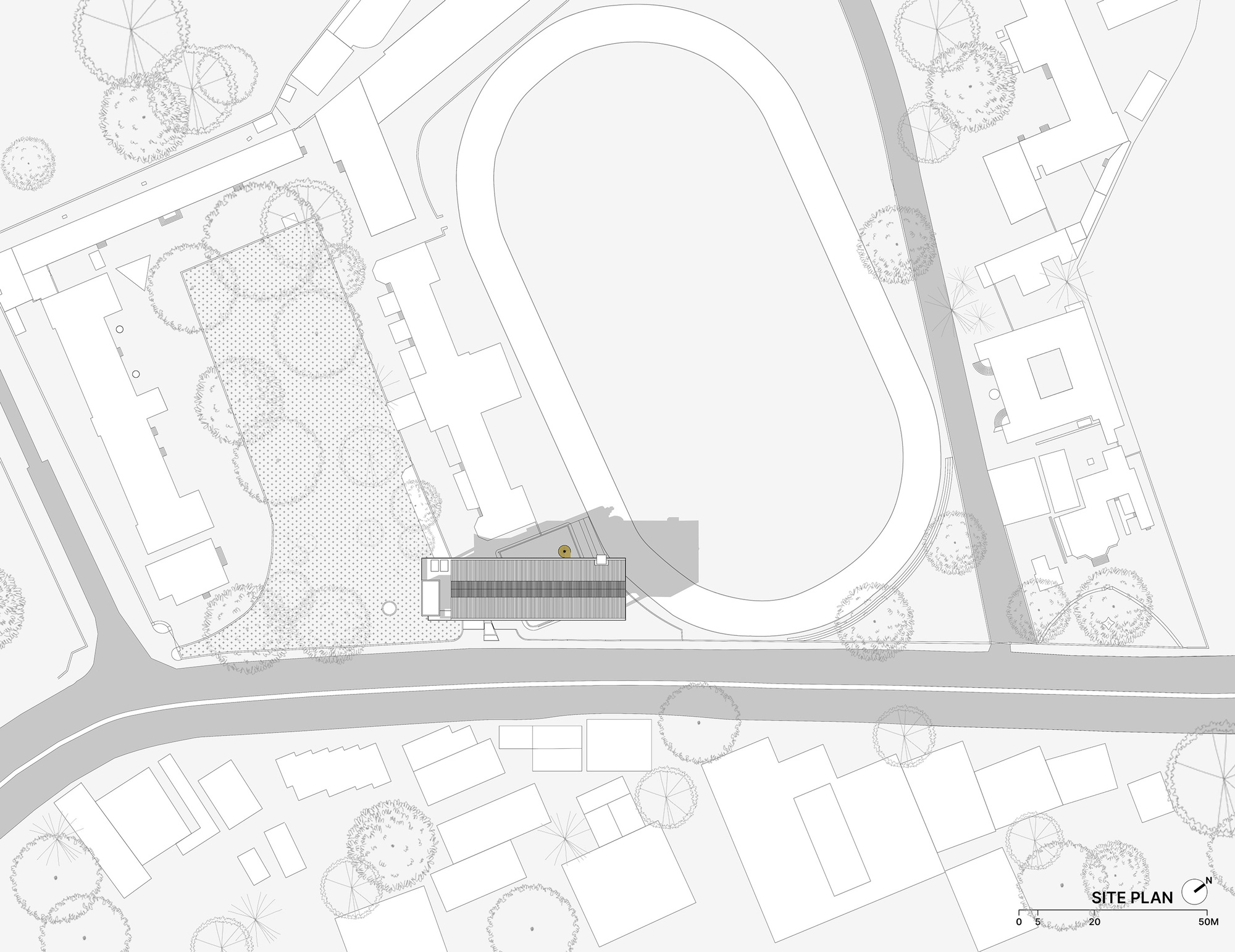 Site plan drawing showing raised building adjacent to running track and landscaped surroundings