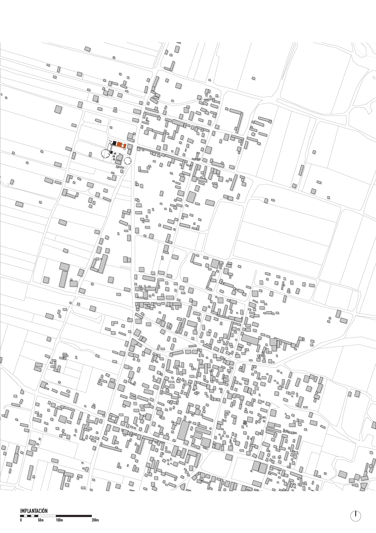 Site plan showing the building highlighted in orange within the surrounding street grid and parcel layout