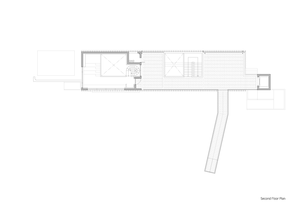Second floor plan drawing revealing skylights and a diagonal stair connecting to the angled wing