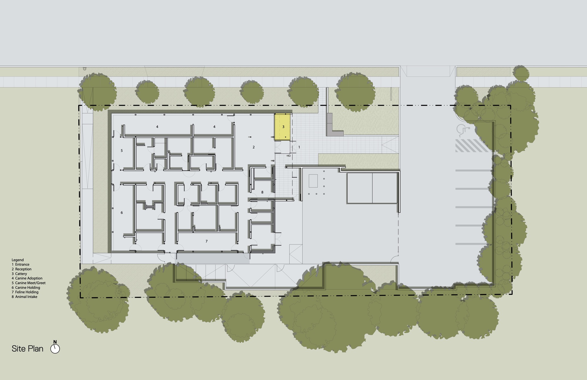 Site plan drawing showing a rectangular building footprint surrounded by trees on three sides