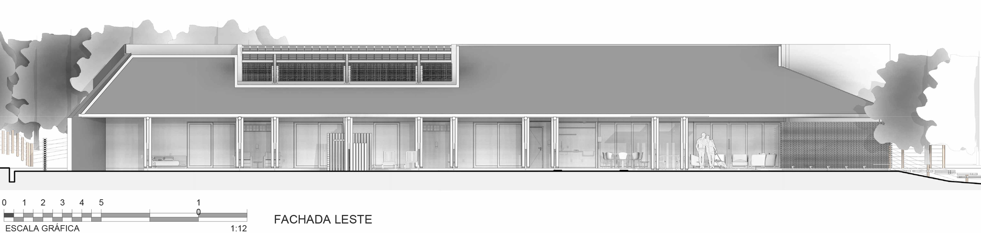 East elevation drawing showing long horizontal facade with clerestory band and overhanging roof