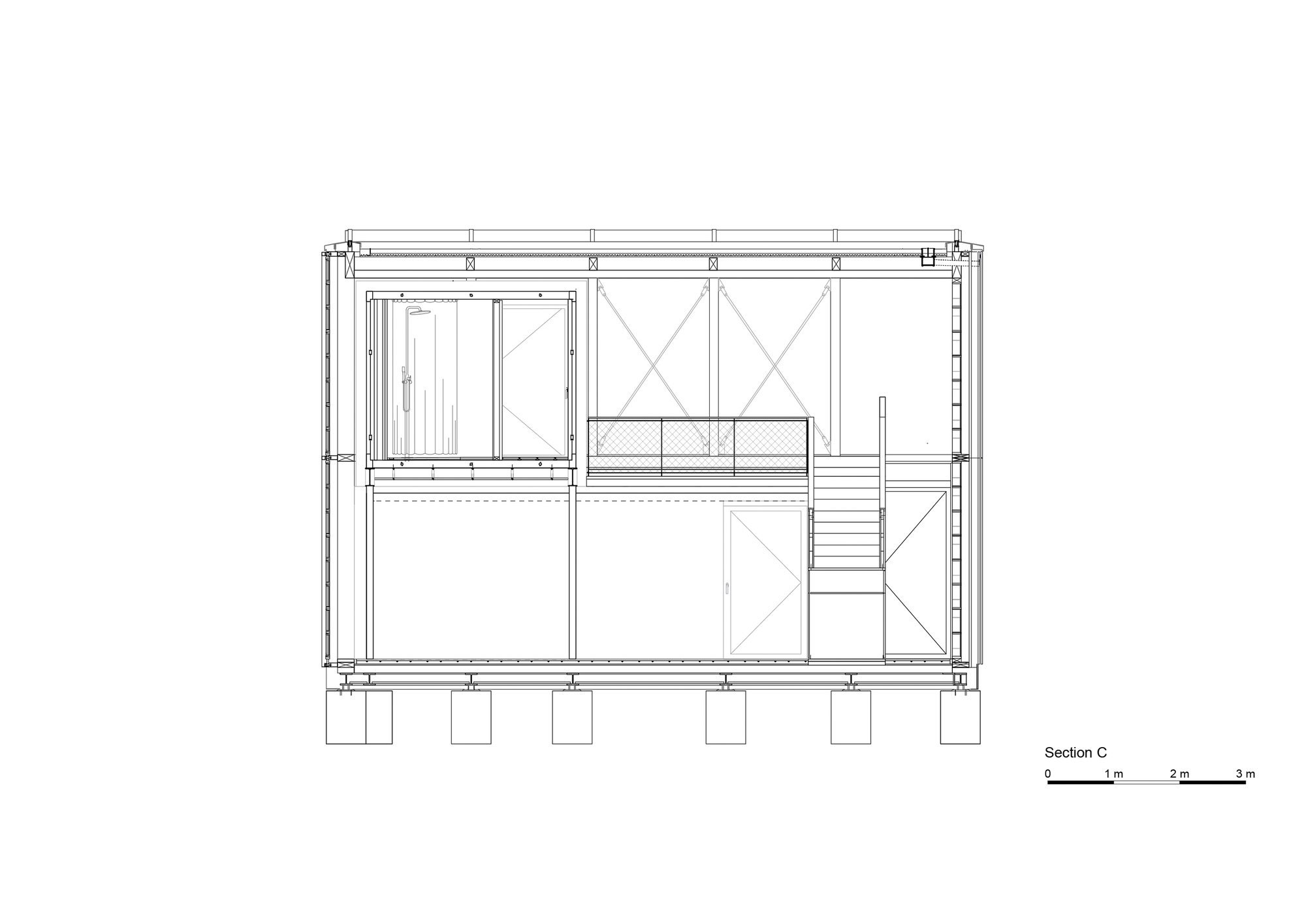 Section drawing revealing interior staircase and upper level mezzanine with diagonal cross-bracing in timber frame
